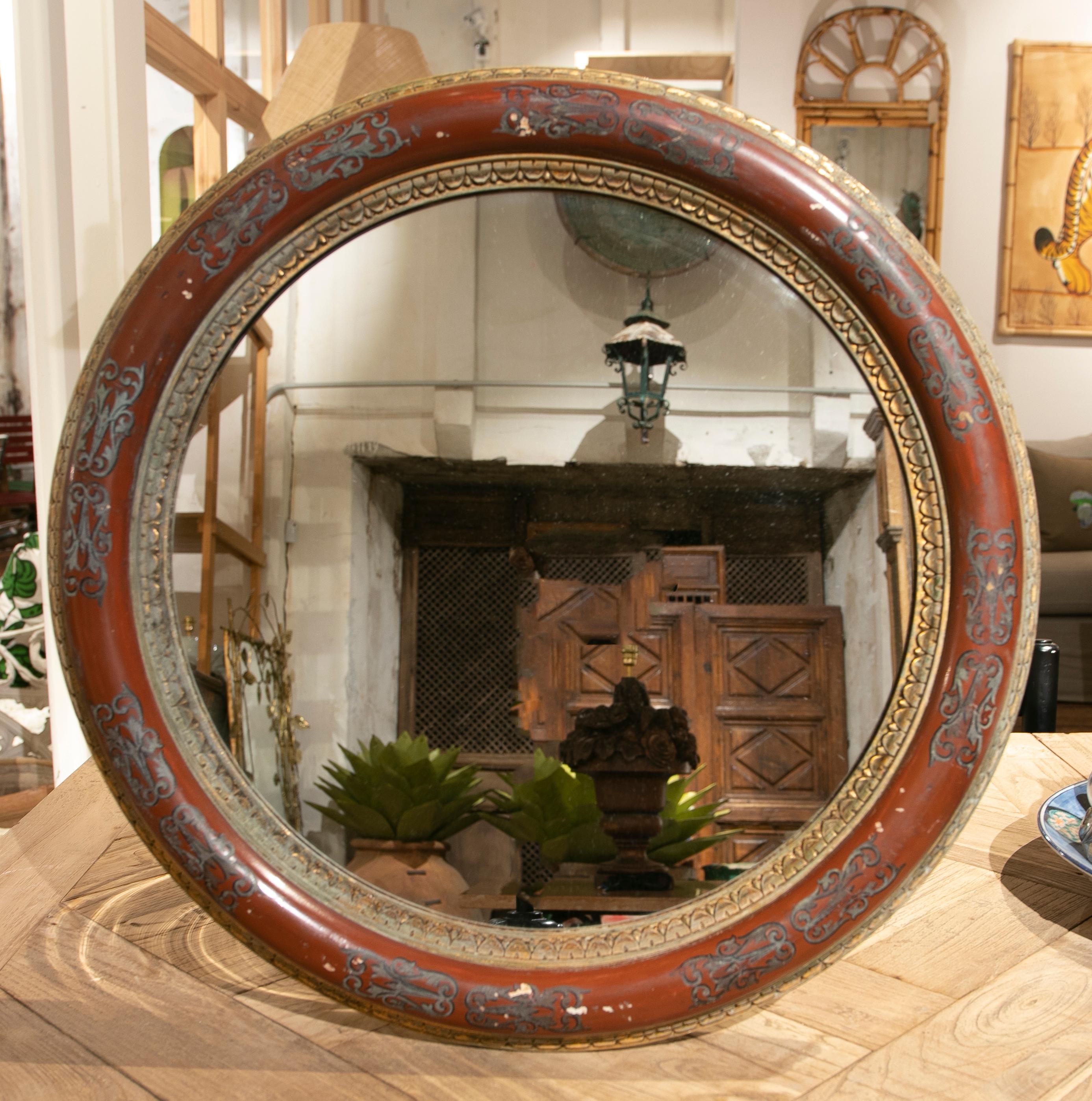 Miroir rond italien des années 1930 avec cadre peint à la main.
