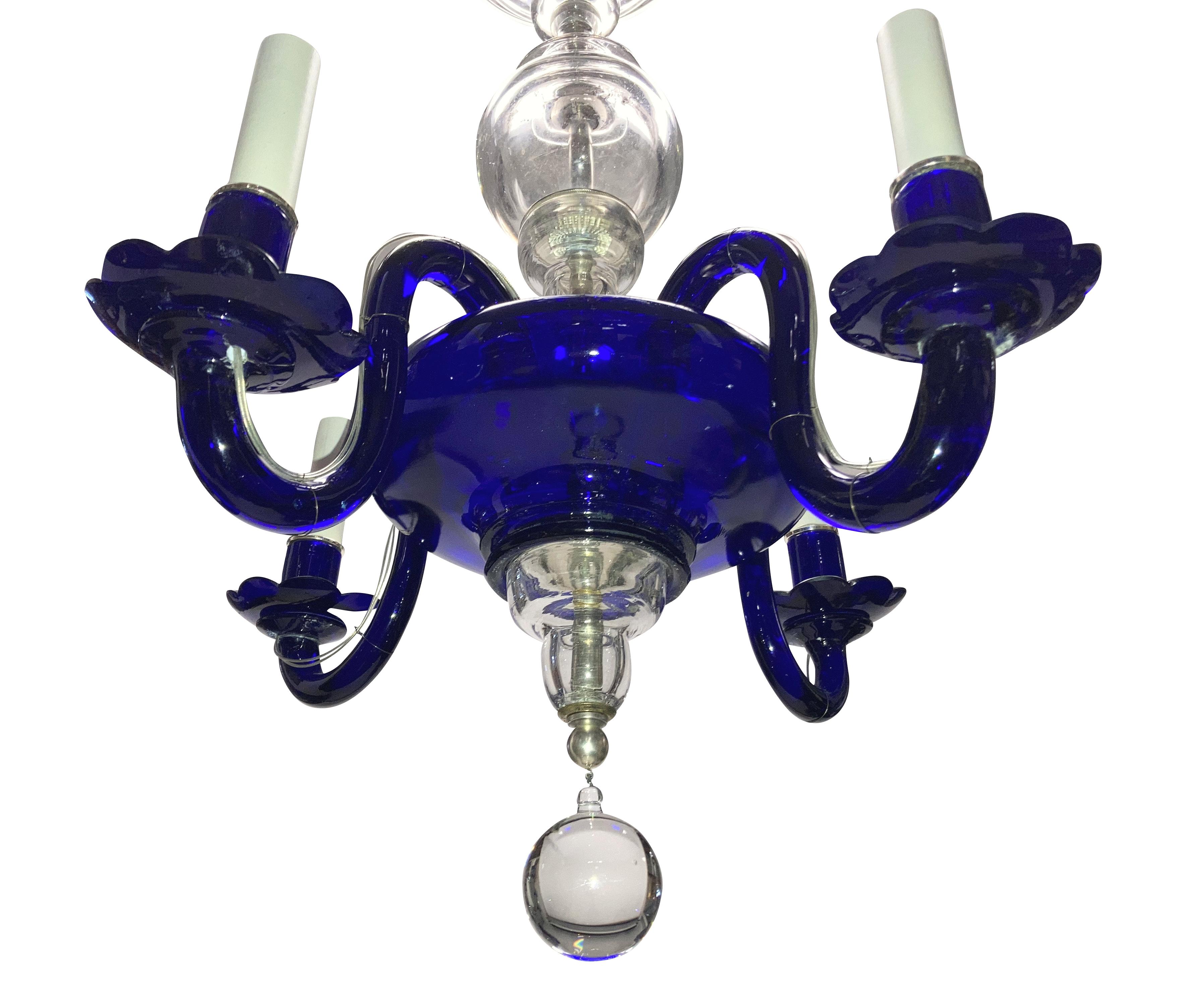An Italian Venetian chandelier of four arms, in both cobalt and clear hand blown glass.
