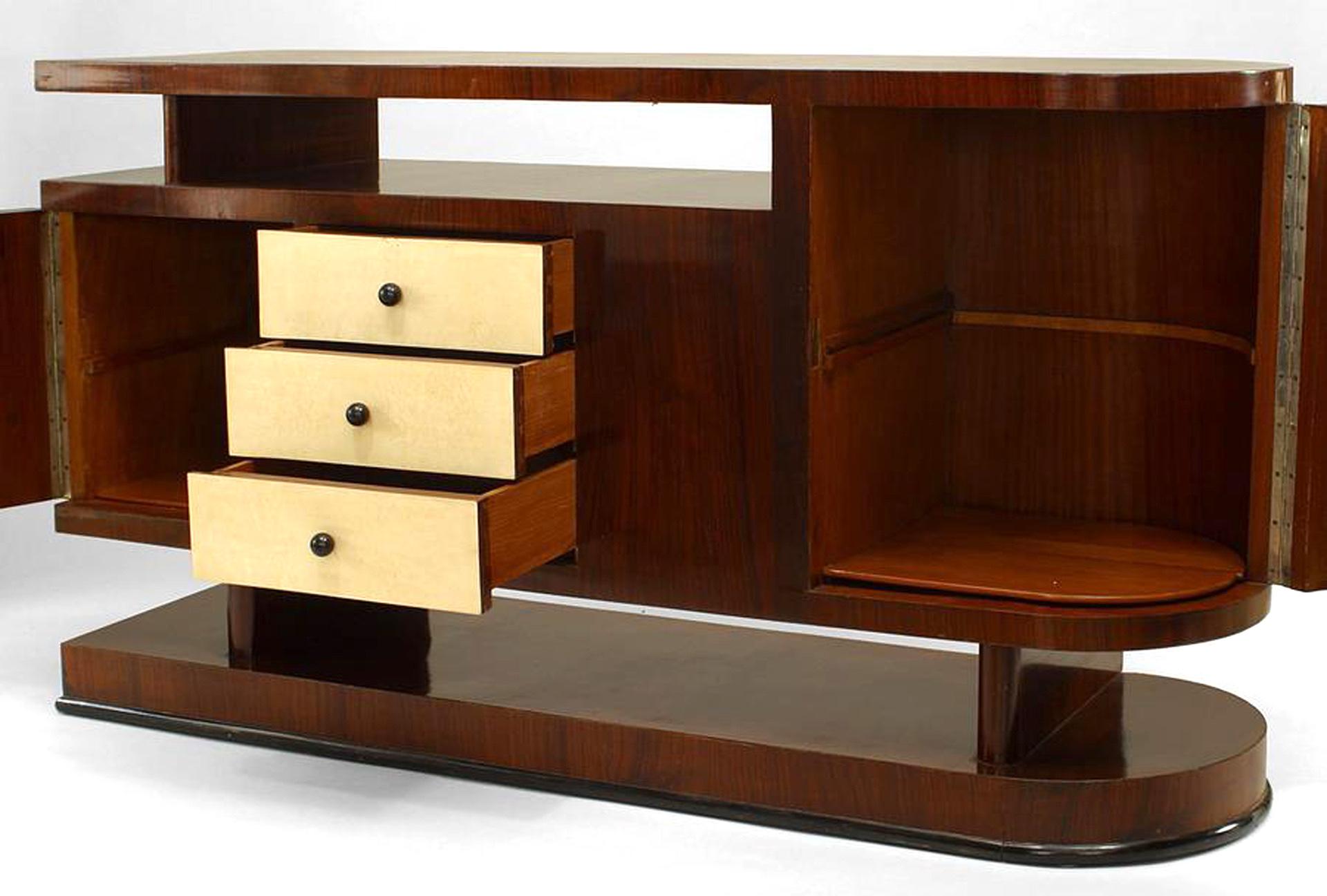 Italian Mid-Century (1930s) walnut sideboard with parchment veneered 2 doors & 3 drawers with rounded end and raised top & platform base with ebonized trim (Manner of A. BERDOLINI)
