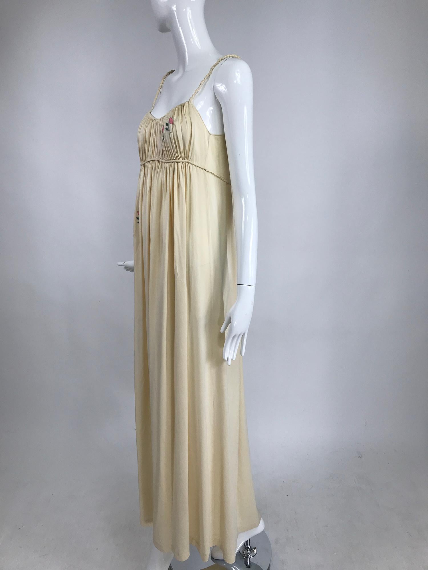 1930s ivory crepe de Chine Applique night gown or dress. Beautiful silk gown has shirred cased elastic straps, a gathered empire bust and long semi full skirt. The bust is gathered and has applique flowers at the front side, the upper skirt also has