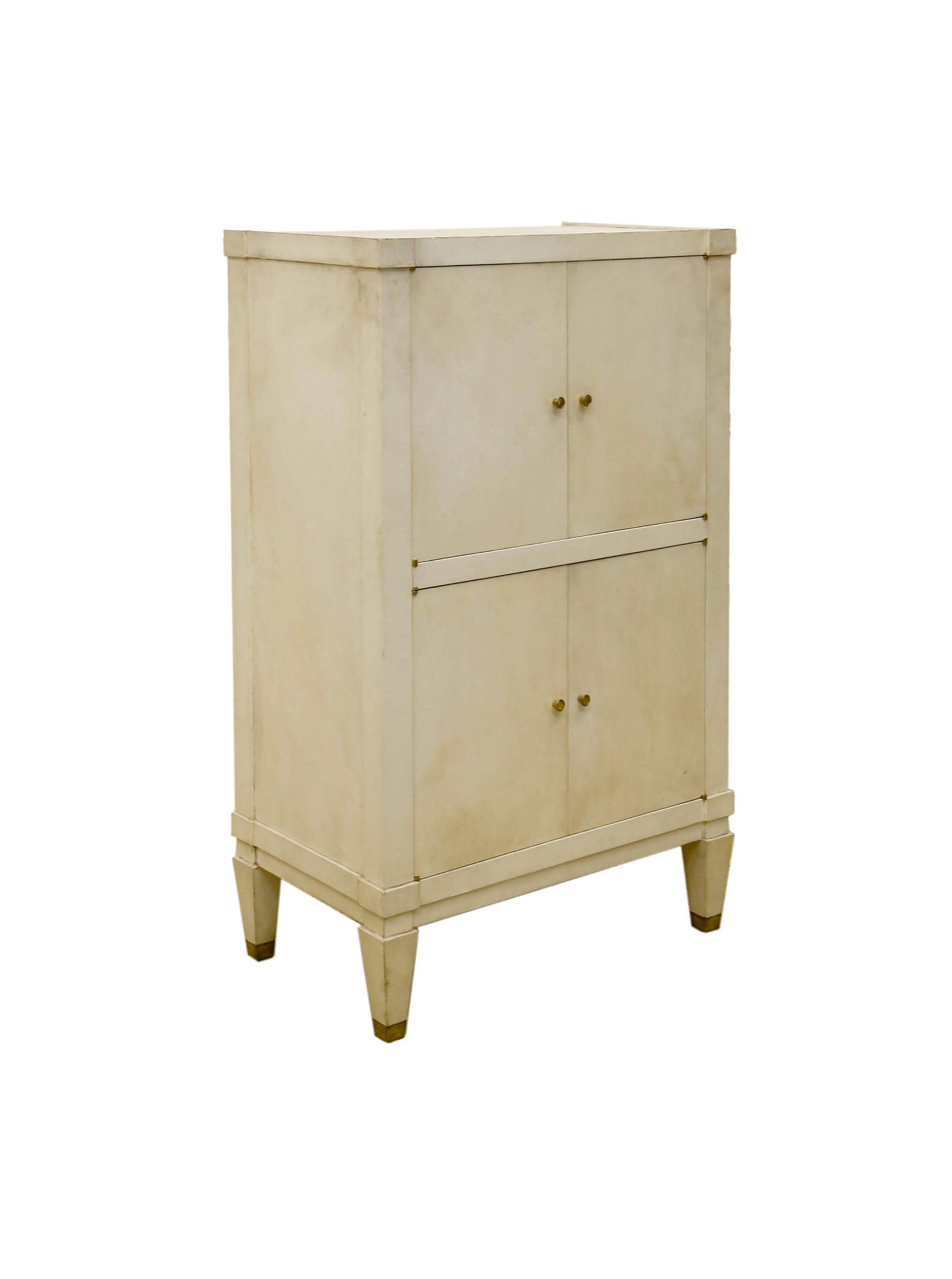 Vellum covered bar cabinet lined in beech wood by Jacques Adnet, circa 1935. A towering figure in twentieth-century avant-garde French design, Jacques Adnet (1900-1984) is remembered for the clean lines and simple forms of an unadorned Art Deco