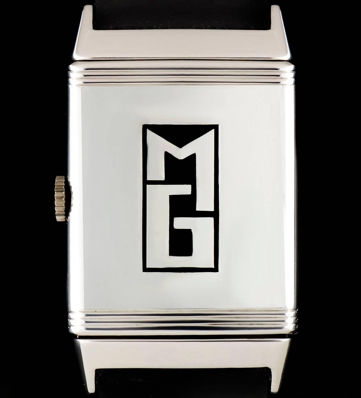 A Stainless Steel Art Deco Vintage Reverso Gents Wristwatch, silver dial with hour markers, centre second dial, a fixed stainless steel bezel, a brand new black leather strap with a stainless steel pin buckle (both not by Jaeger LeCoultre), plastic
