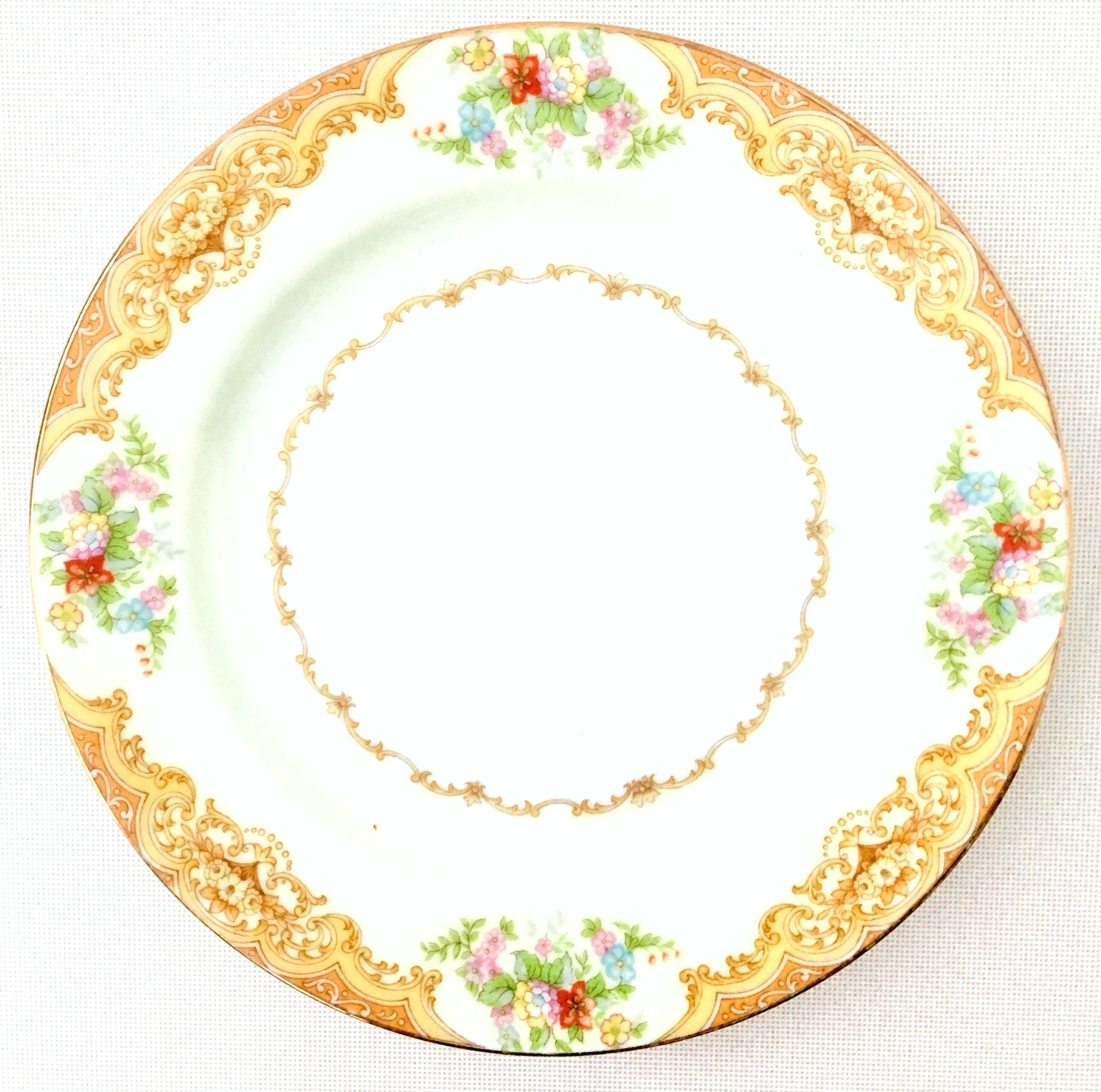 1930'S Art Nouveau hand painted Japanese porcelain set of nine salad/dessert plates by, Noritake-Morimura Brothers. Pattern features a white ground, golden paisley and scroll rim pattern over a band of creamy yellow with a 22-karat gold edge detail.