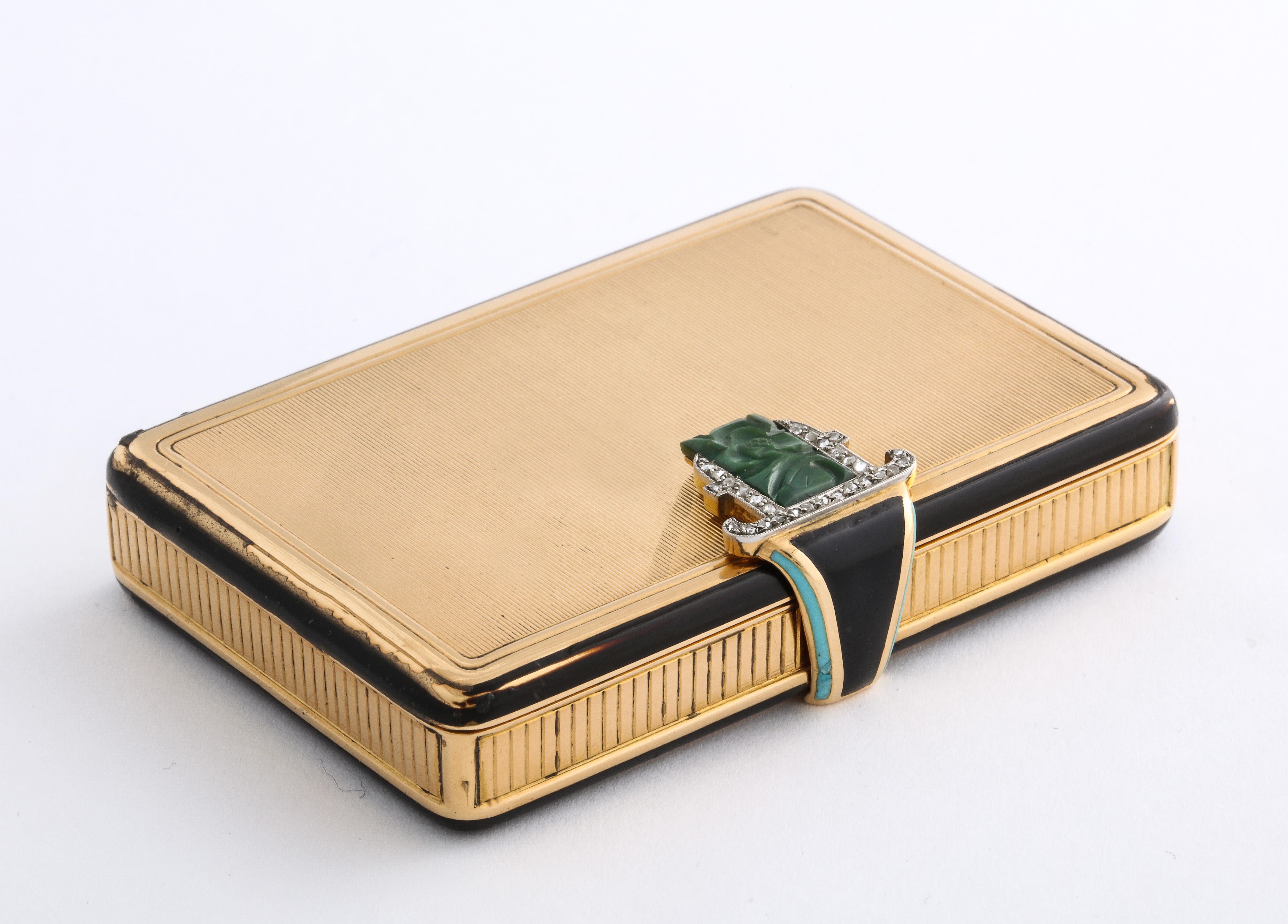 1930's Handsome 18k Gold Cartier Compact, with Carved Jade and Diamond Clasp.

Marked: 750 for 18k Gold
Numbered: 08429 w/ French Hallmarks
121 Grams of 18k Gold
Black Enamel throughout with Diamonds and Carved Green Jade
Measures: 2 ½ x 1 ¾ x ½ inch