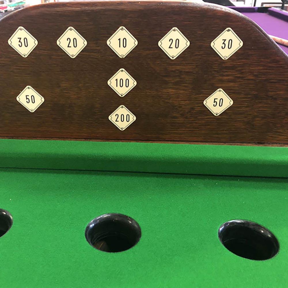 Billiards is one of the oldest table games in the world, and this specially made table is the perfect place to play.

Bar billiards is a historic game, widely thought to be based on bagatelle, the same game that spawned modern pinball tables. This