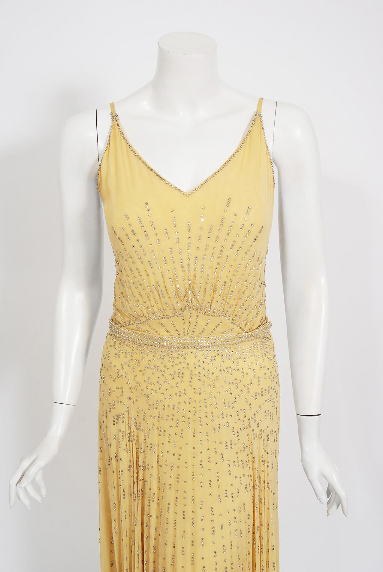 Unique evening slip dresses from the 1930's era are perennial favorites and this Julius Garfinckel and Co. couture garment is a showstopper. Garfinckel was a prominent department store based in Washington, D.C. that catered to extremely wealthy