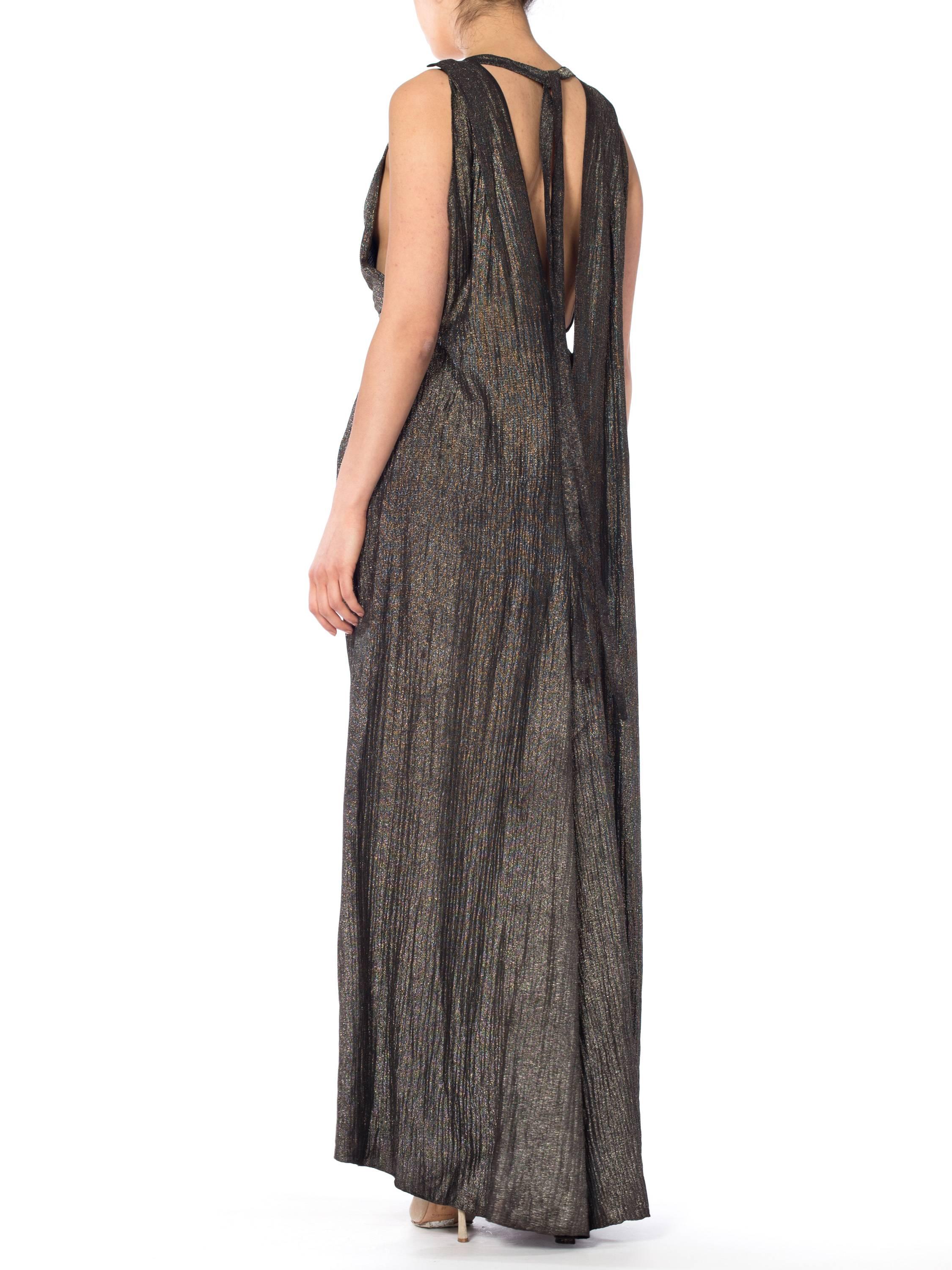 MORPHEW COLLECTION Black & Gold Antique Patina Silk Lamé  Gown With Low Back And Caped Train
MORPHEW COLLECTION is made entirely by hand in our NYC Ateliér of rare antique materials sourced from around the globe. Our sustainable vintage materials