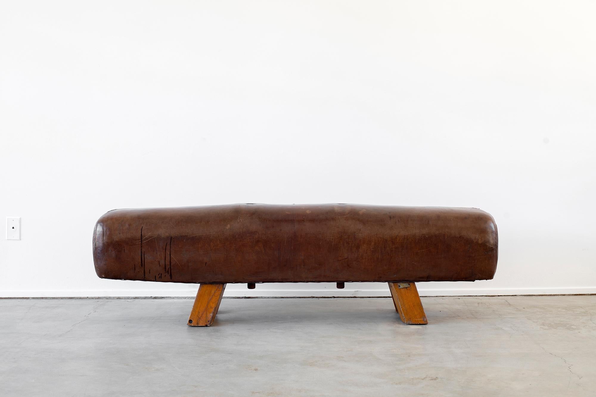 Wonderful Belgian leather gym bench circa 1930s with fantastic patina and lines.
 
  