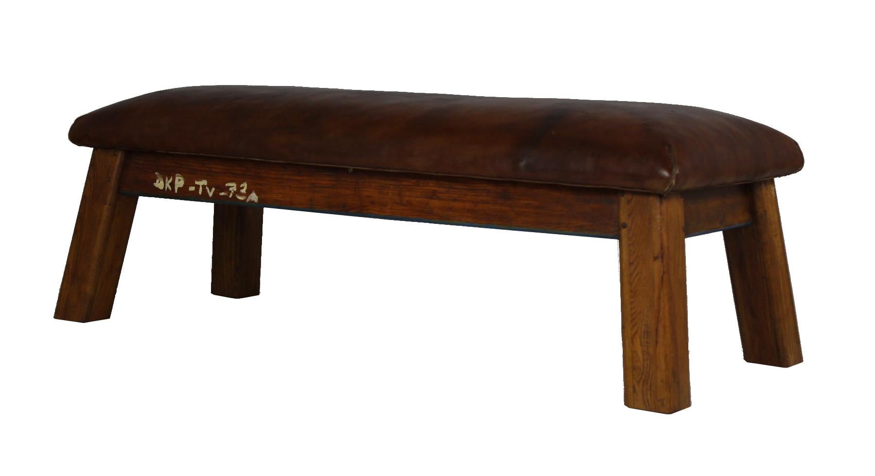 Leather gym bench from the 1930s. The top is made from thick leather, wooden legs. The bench is in very good original condition.