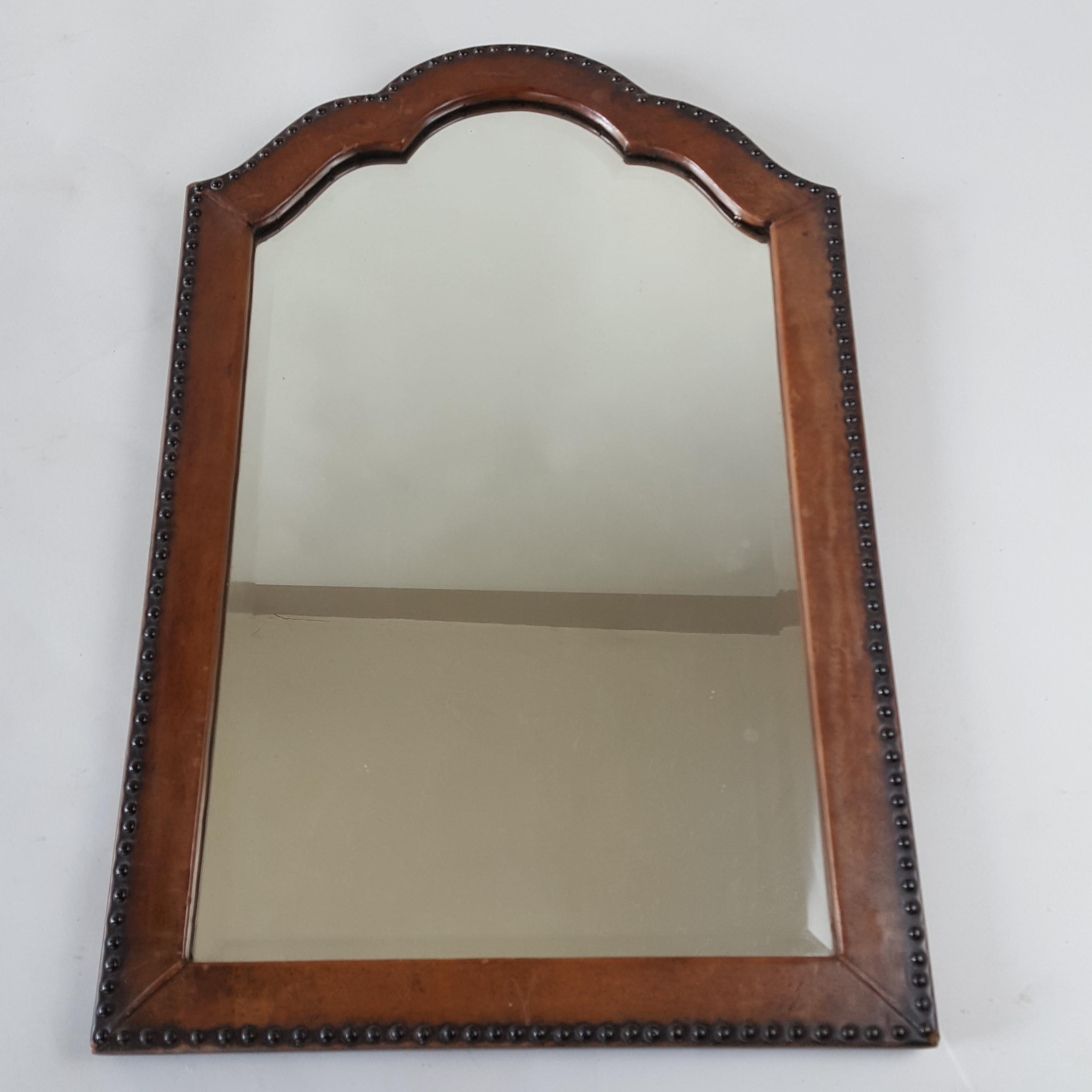 Pretty 1930's original leather framed mirror with bevelled plate. The mirror is in good condition.