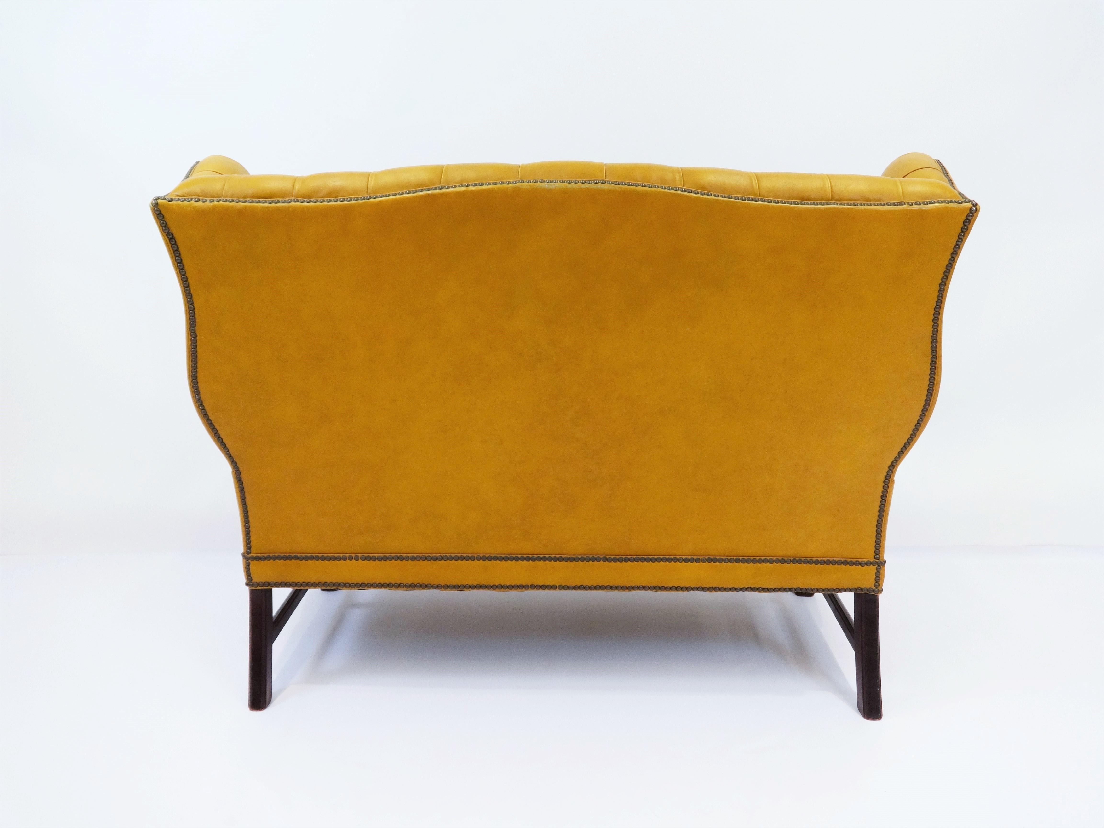 tufted leather settee