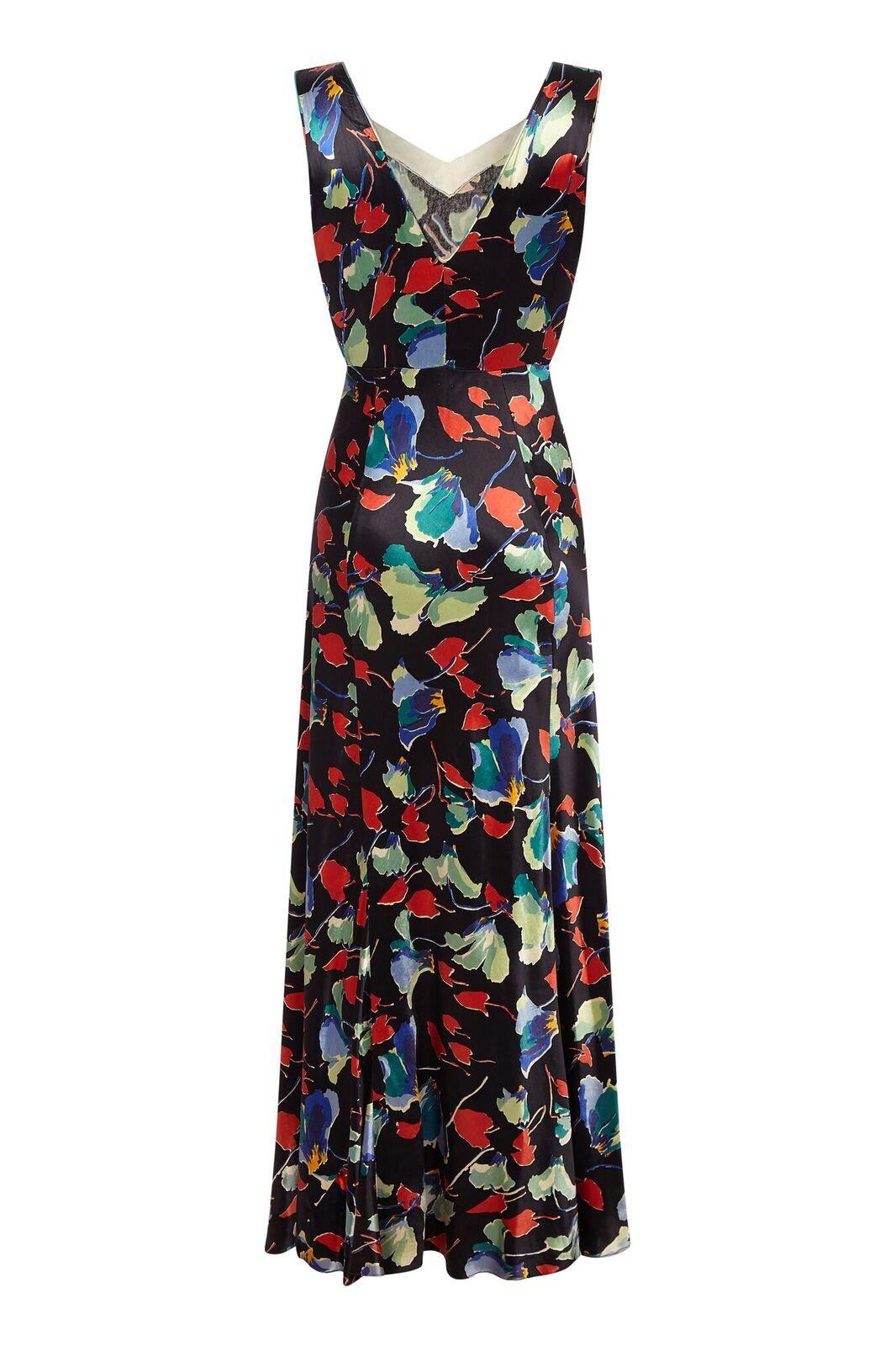 This divine 1930s liquid satin bias cut gown is in such extraordinary vintage condition it is hard to believe it is of this era. The colours of abstracted floral print are still absolutely luminous and dance across the black background in crimson,