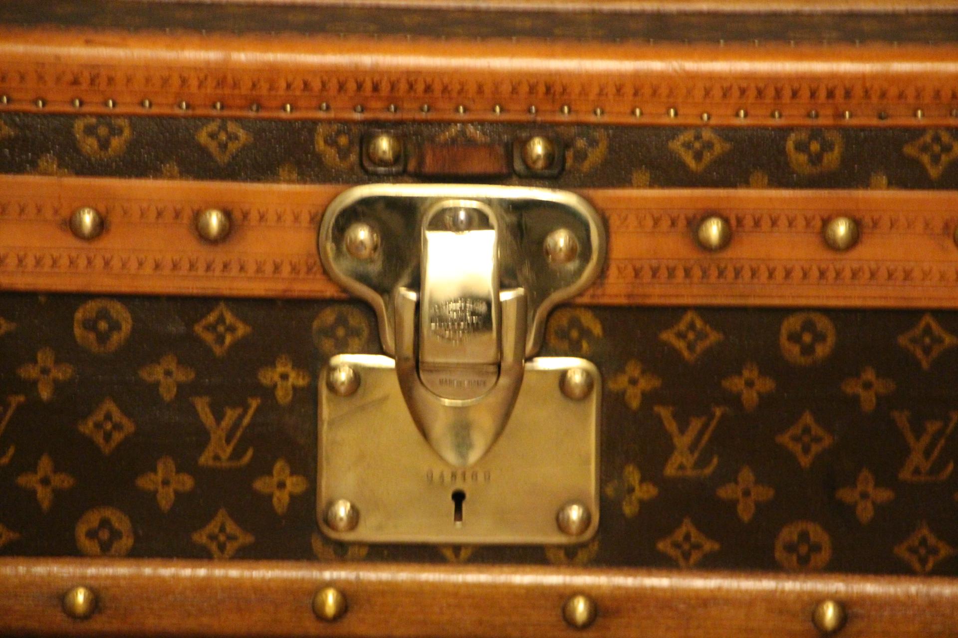 This superb Louis Vuitton steamer trunk features stenciled monogram canvas, lozine trim, LV stamped solid brass locks and studs as well as leather side handles and brass corners. It has got a beautiful original patina and is very elegant.
Its