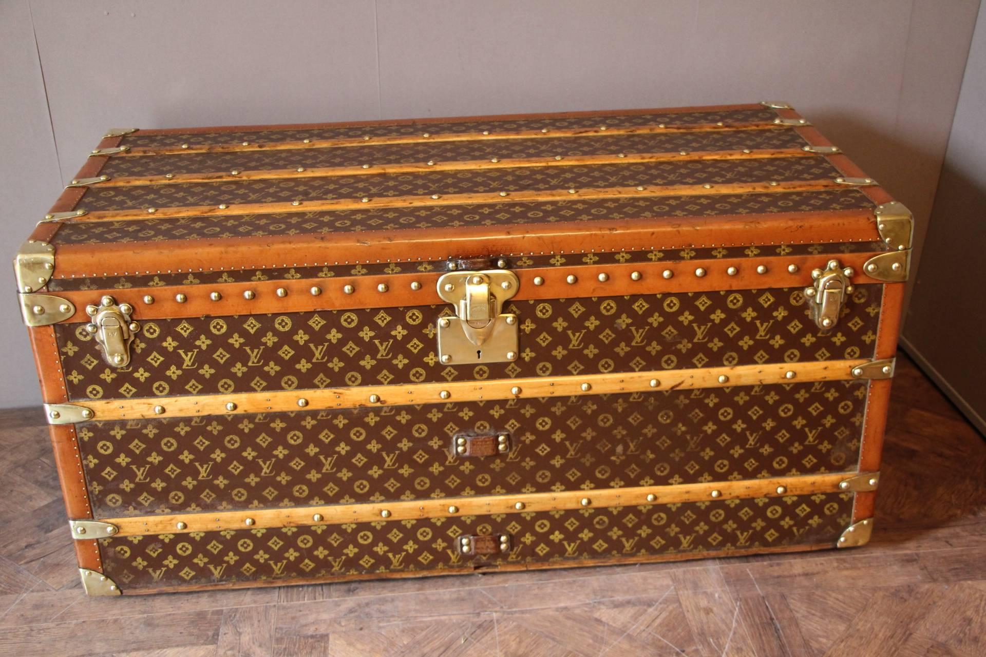 This superb Louis Vuitton steamer trunk features stenciled monogramm canvas, lozine trim, LV stamped solid brass locks and studs as well as leather side handles and brass corners. It has got a beautiful original patina and is very elegant.
Its