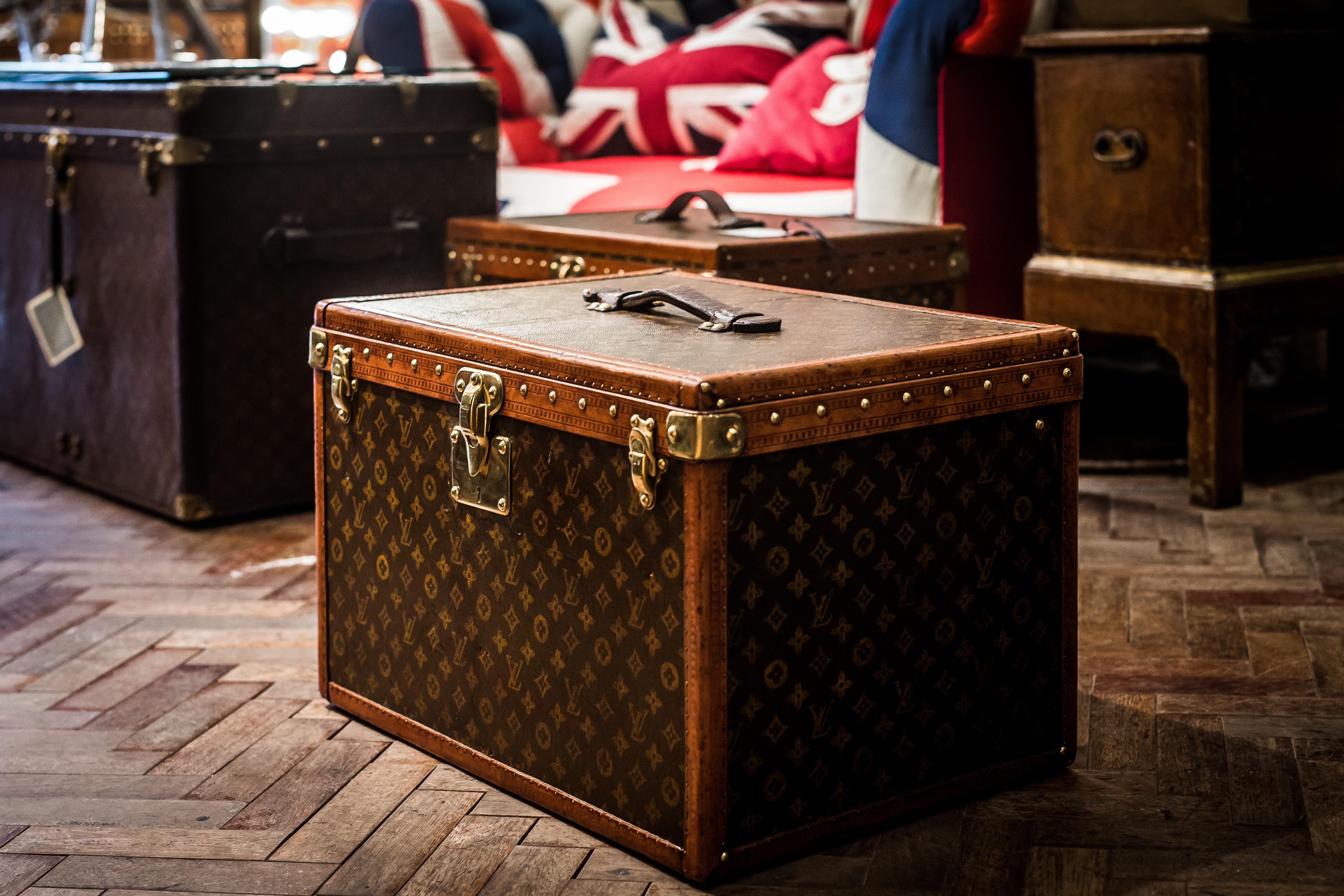 A beautiful Hat trunk that is entirely covered by the signature stencil monogrammed canvas from Louis Vuitton circa 1930s. 

It features:
- Lozine trim, 
- Brass hardware. 
- a leather handle on the top of the trunk

The spacious interior features