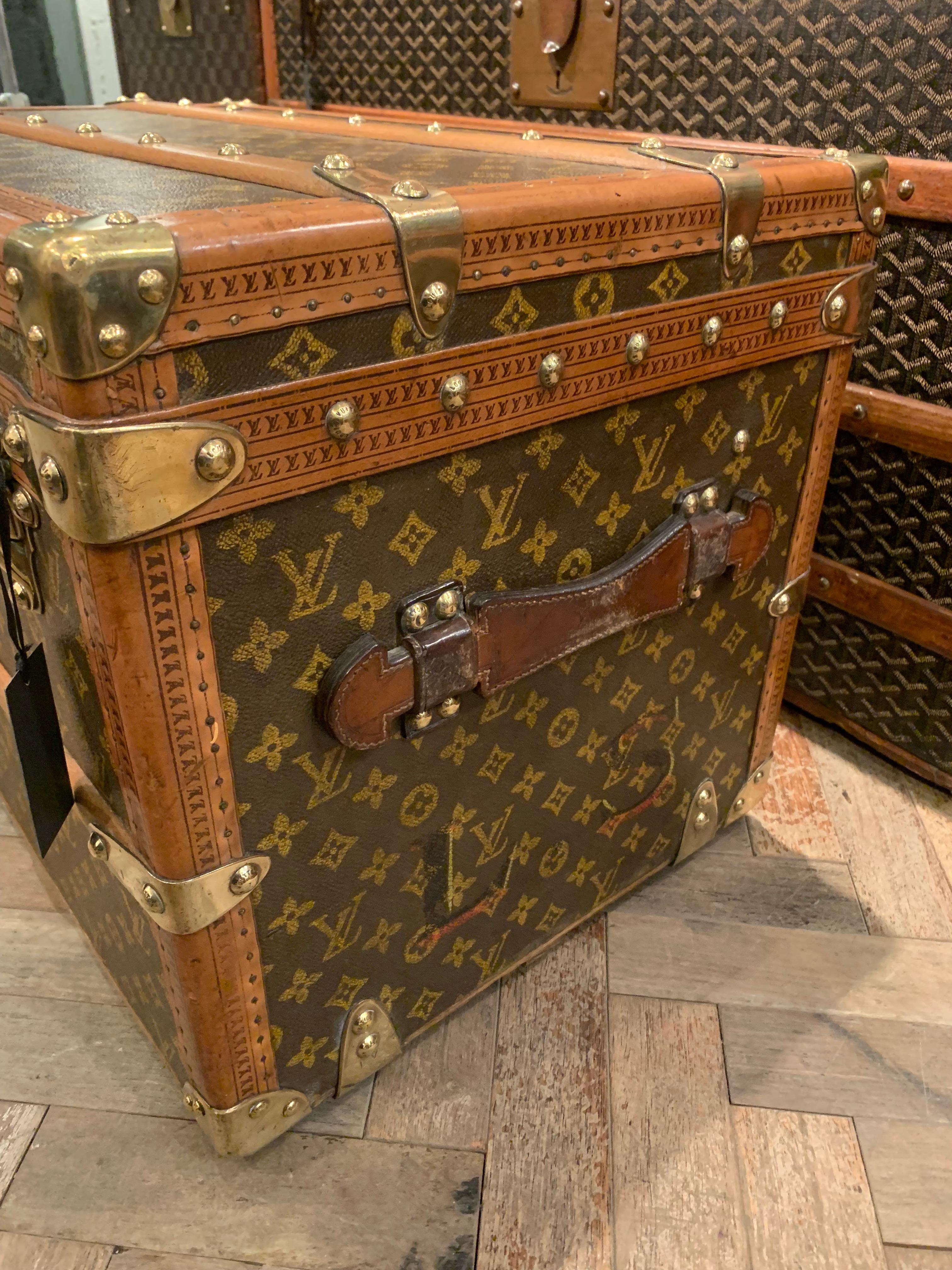 A beautiful shoe trunk that is entirely covered with the signature stencil monogrammed canvas from Louis Vuitton circa 1930s. 

It features:
- Lozine trim, 
- Wooden slats 
- Brass hardware. 

Original owner’s initials are painted on the side