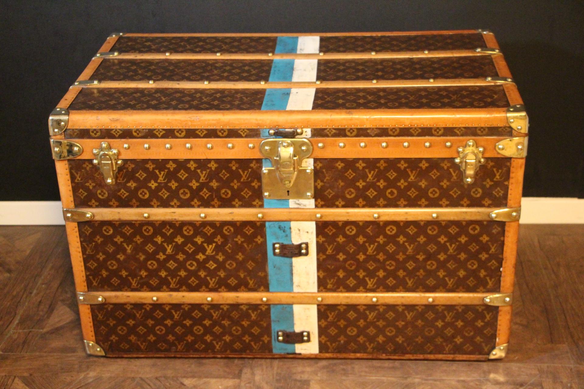 This superb Louis Vuitton steamer trunk features stenciled monogram canvas,honey color lozine trim, LV stamped solid brass locks and studs as well as leather side handles and brass corners. It has got a beautiful original patina and is very