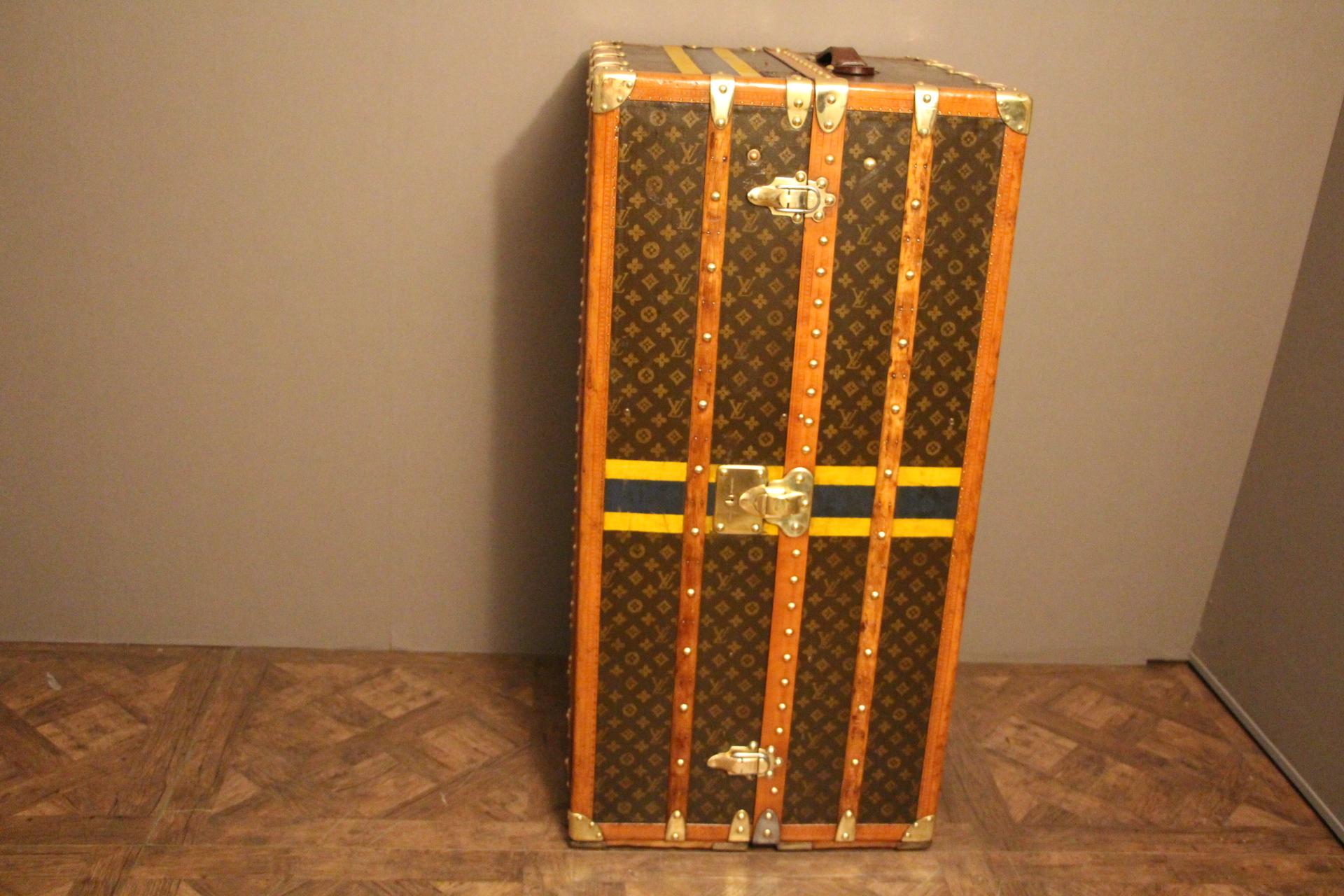 This all original Louis Vuitton wardrobe steamer trunk features stencilled monogram canvas as well as all stamped solid brass fittings: locks, corners and studs. Series number is stamped on its main lock. Two leather handles, one on the top and the