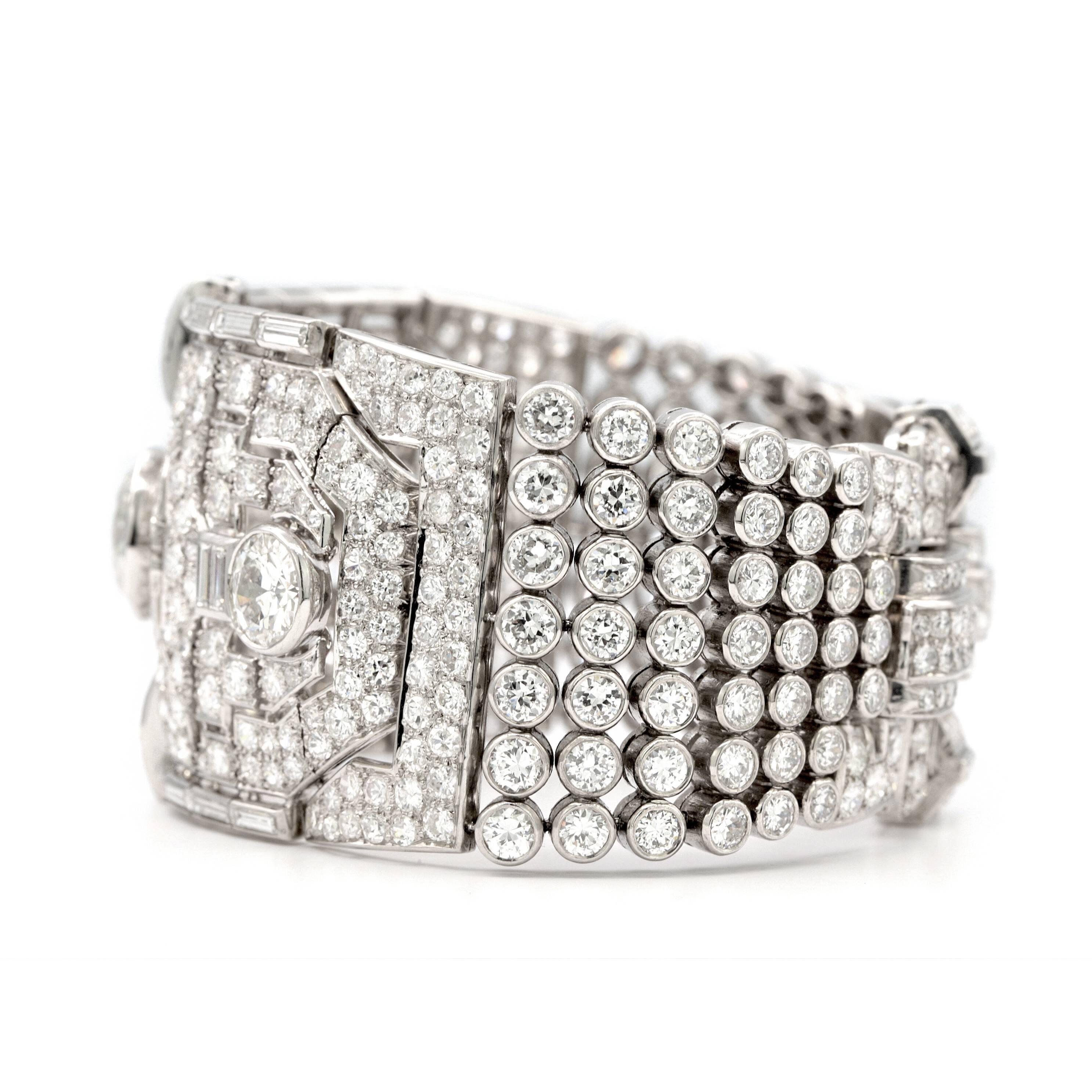 Designed with delicate and solid openwork pattern set with old European and emerald cut Diamonds that weight approximately 60.00 carats.


Circa 1930  