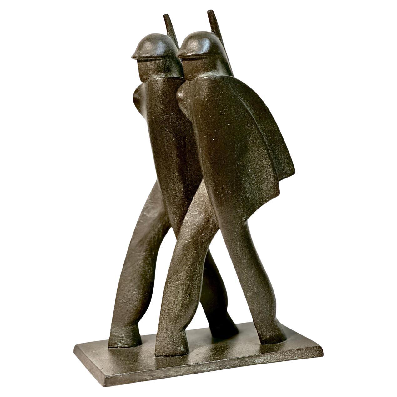 1930s "MARCHING SOLDIERS" SCULPTURE BY DI BOSSO For Sale