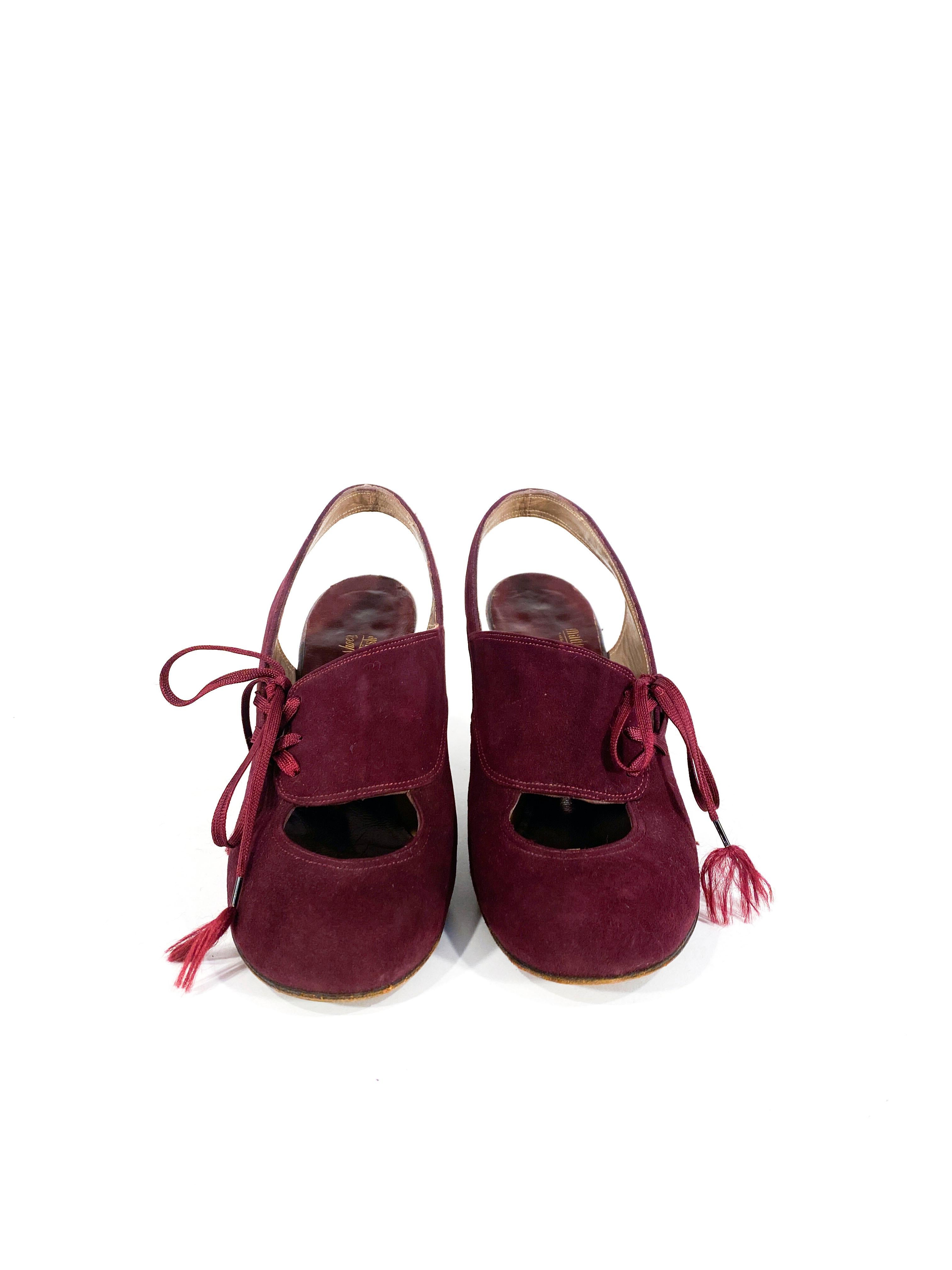 1930s Maroon suede sling-back round-toe heels with topstitching, a large cut out accent above the toes, and a laced adjustment to tighten the top of the vamp. The laces are original with steel aglets and the heels are 3.25 inches tall. 