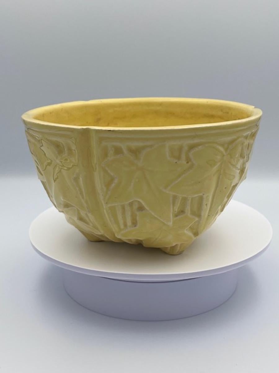 1930s McCoy Pottery Sunshine Yellow Hanging Ivy Basket Planter 

This stunning 1930s McCoy Pottery Hanging Ivy Basket Planter in vibrant sunshine yellow is a beautiful example of vintage American pottery. Known for its classic style and durable