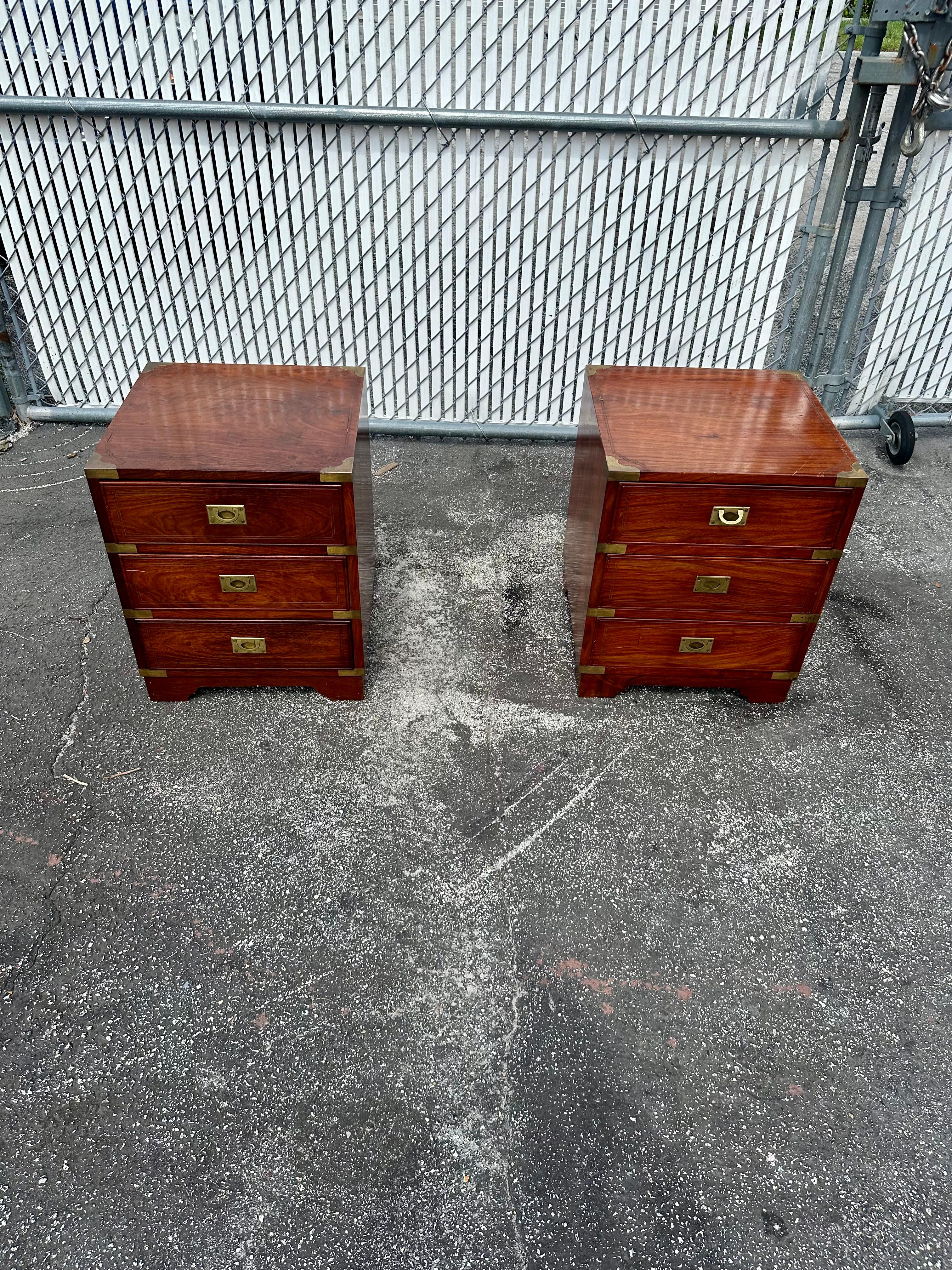 We delight to offer for sale this amazing pair of medium size Anglo-indian campaign style nightstands with three drawers , brass handles and made by hardwood with brass inlayed brass. In very good antique condition. Structurally sound. No cracks.