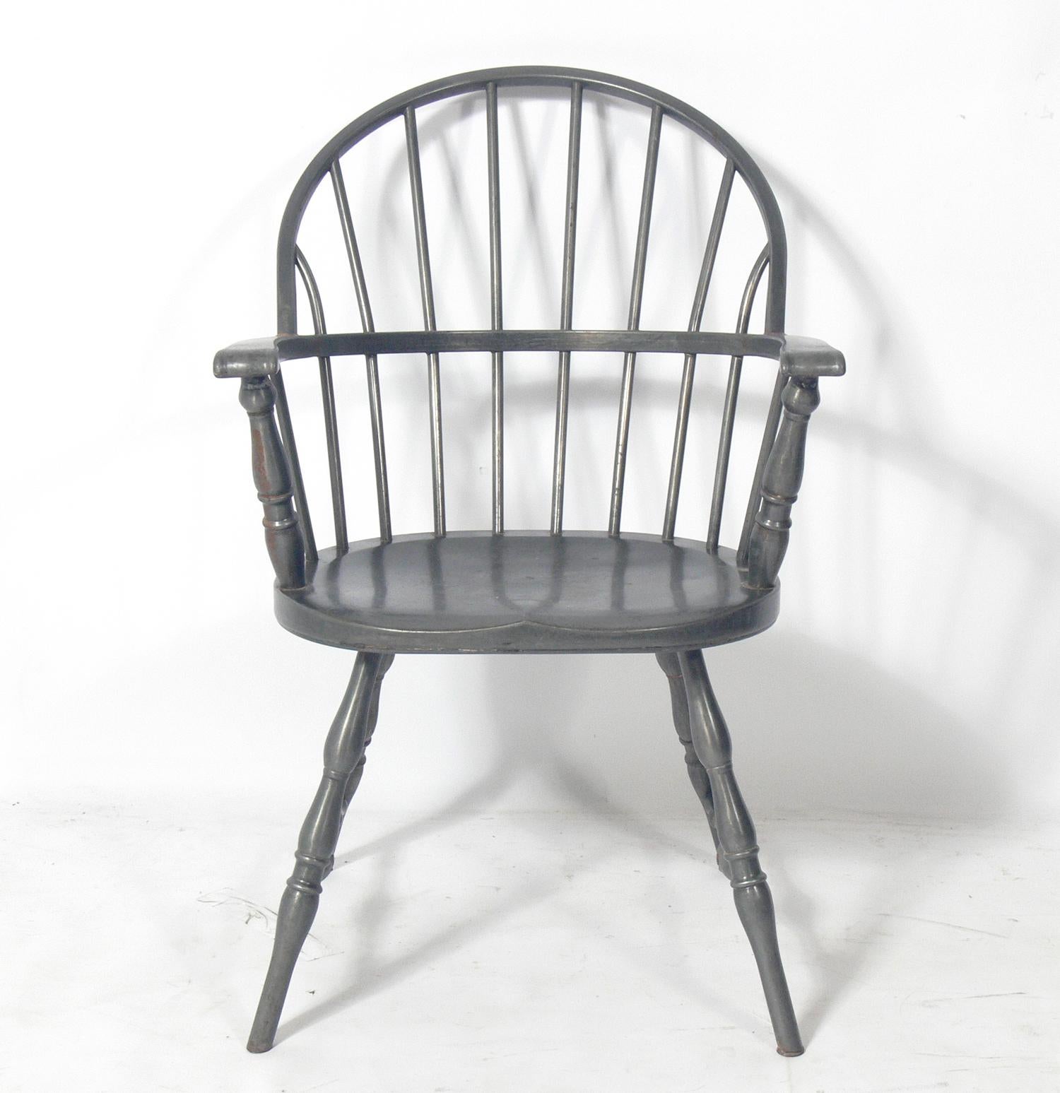 Metal Windsor chair, American, circa 1930s. The stripped metal lends it an industrial feel. It is missing a cross stretcher that would have connected the legs at the center. See last detail photo. Still strong and sturdy.