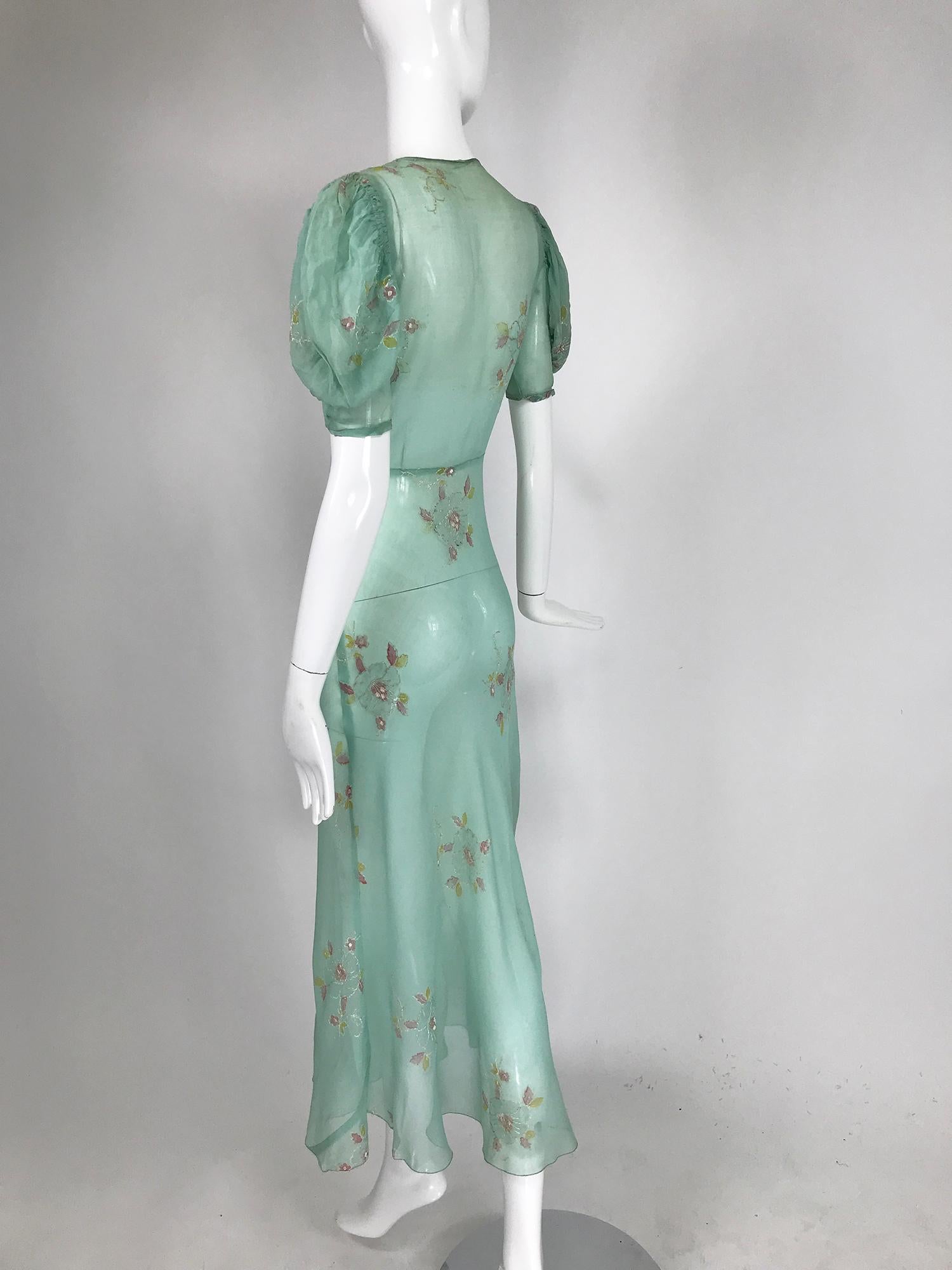 sheer ruffle shoulder asymmetric hem maxi dress with corsage detail in orange floral jacquard