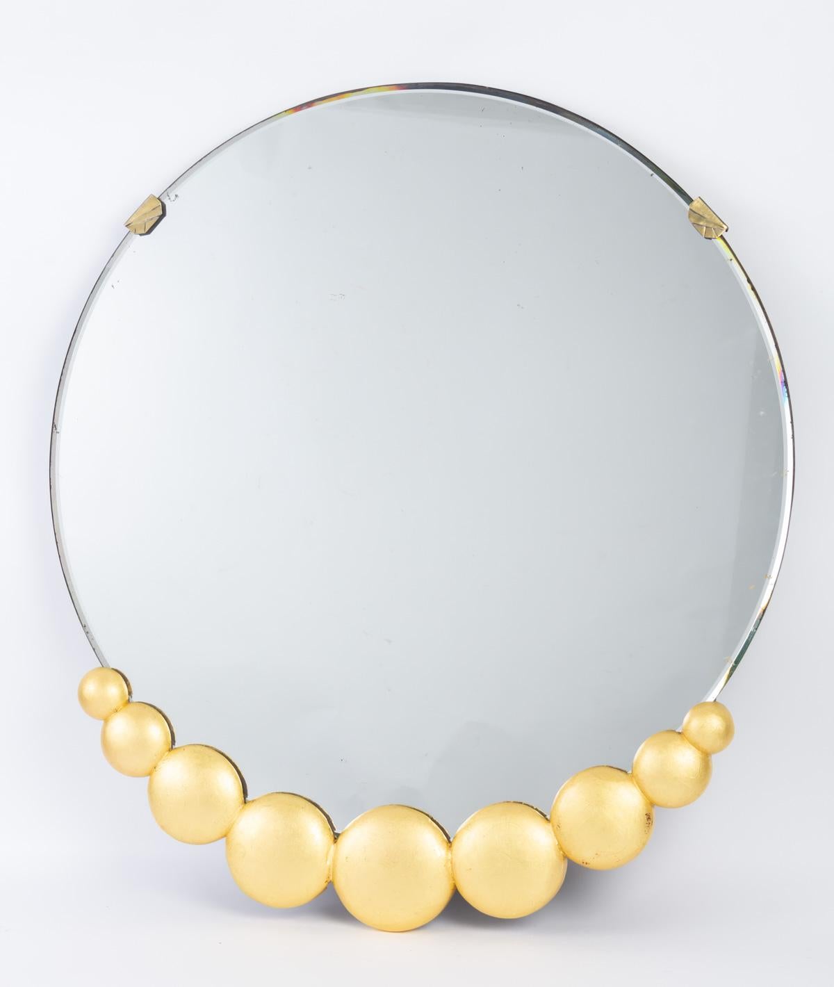 1930s mirror with gold leaf, bevelled glass. Paris.

H: 67 cm, d: 60 cm