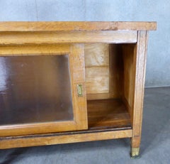 1930s Mission-Style Oak Mercantile Cabinet with Sliding Glass Doors