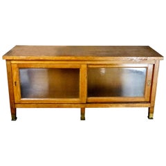 1930s Mission-Style Oak Mercantile Cabinet with Sliding Glass Doors