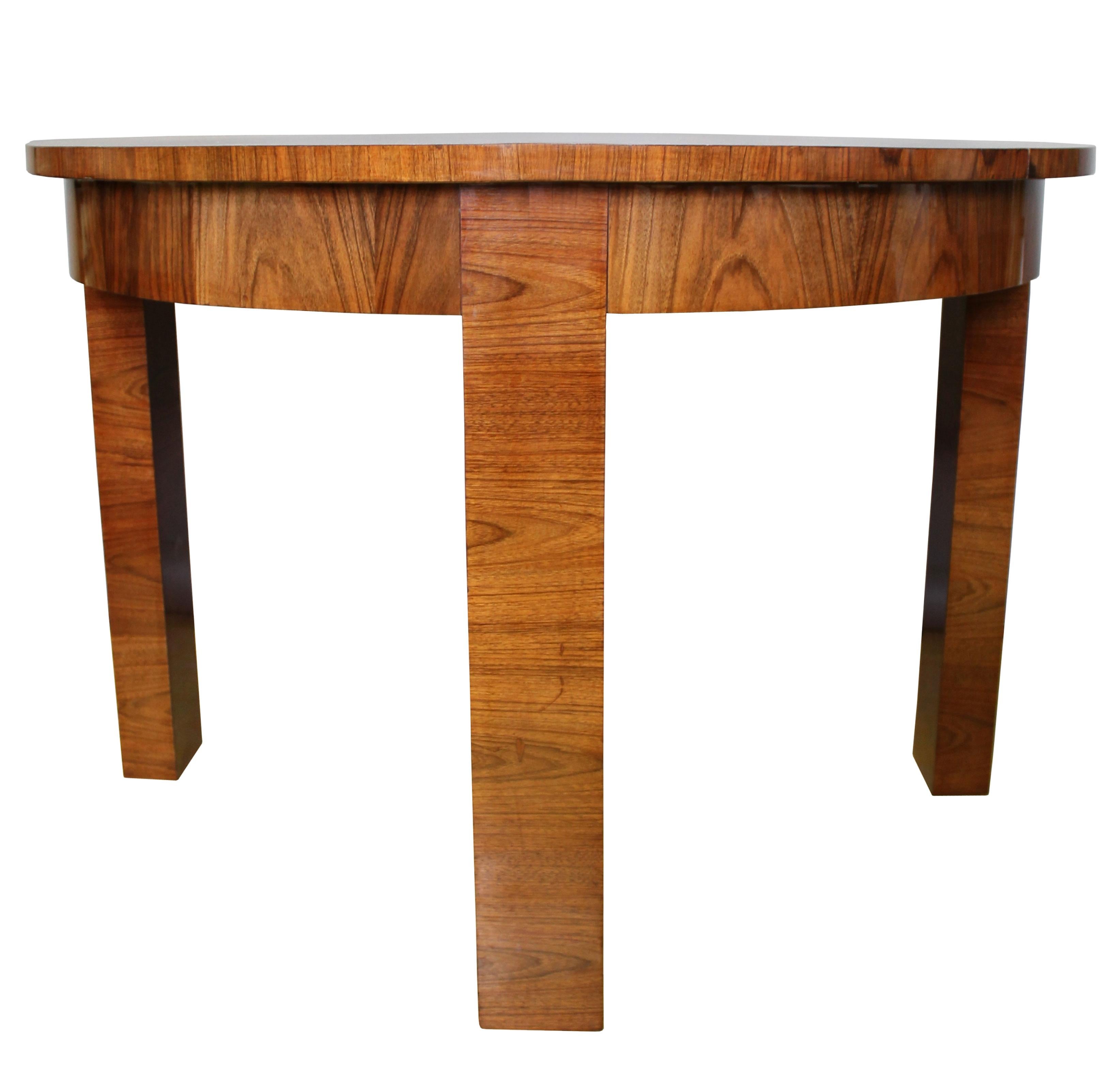 An original Modernist dining table from the 1930s. This table has a dignified design with stylish proportions together and a dazzling Walnut pattern to the table top and also the legs.

This piece was sourced in Brno, Czech Republic. It is