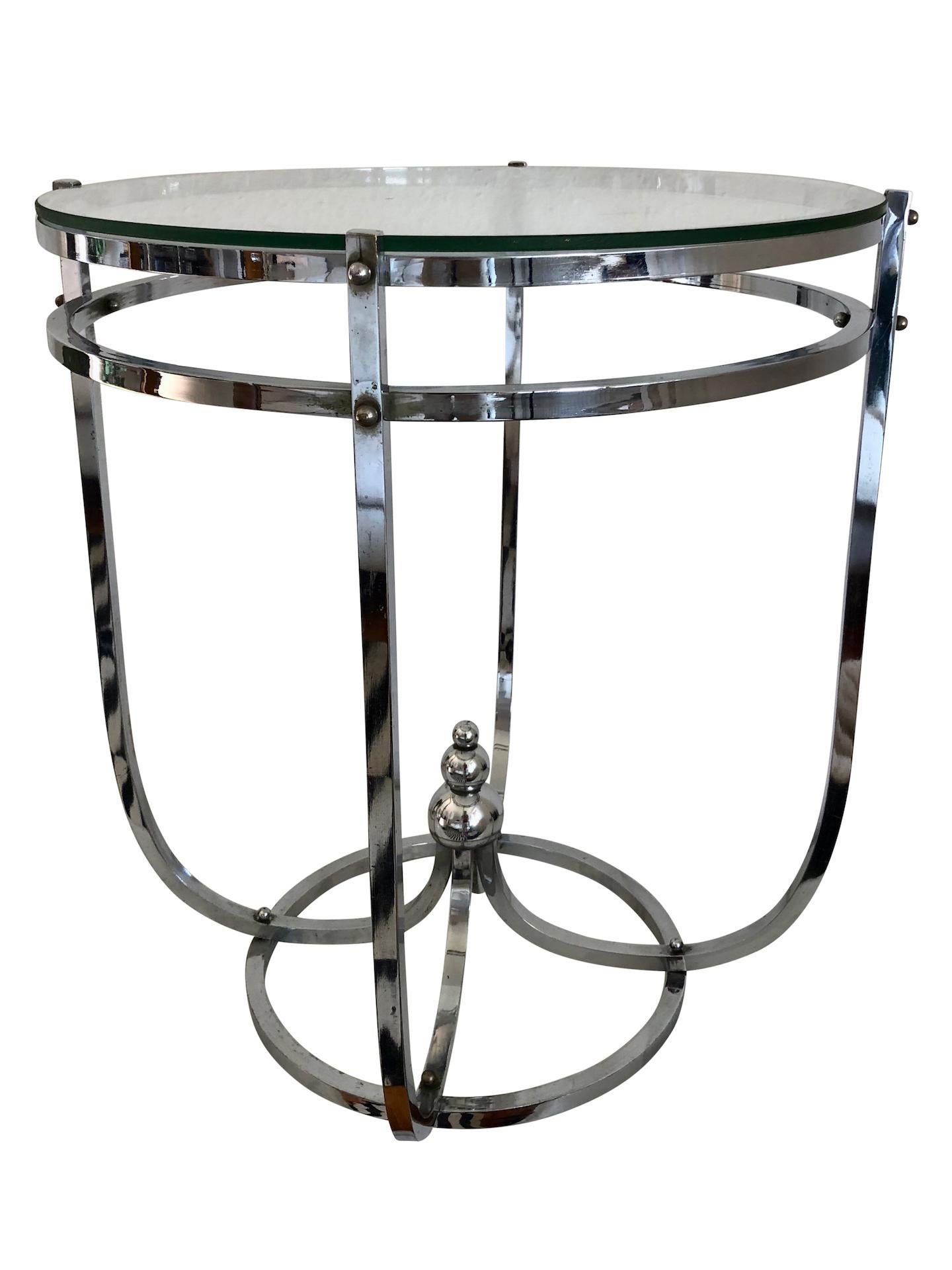 Modernistic side table / couch table
Original Art Deco, France 1930s.

Original chromed metal (probably brass), just cleaned, not polished to protect the original patina
7 mm glass tabletop (with slight surface scratches because of age and