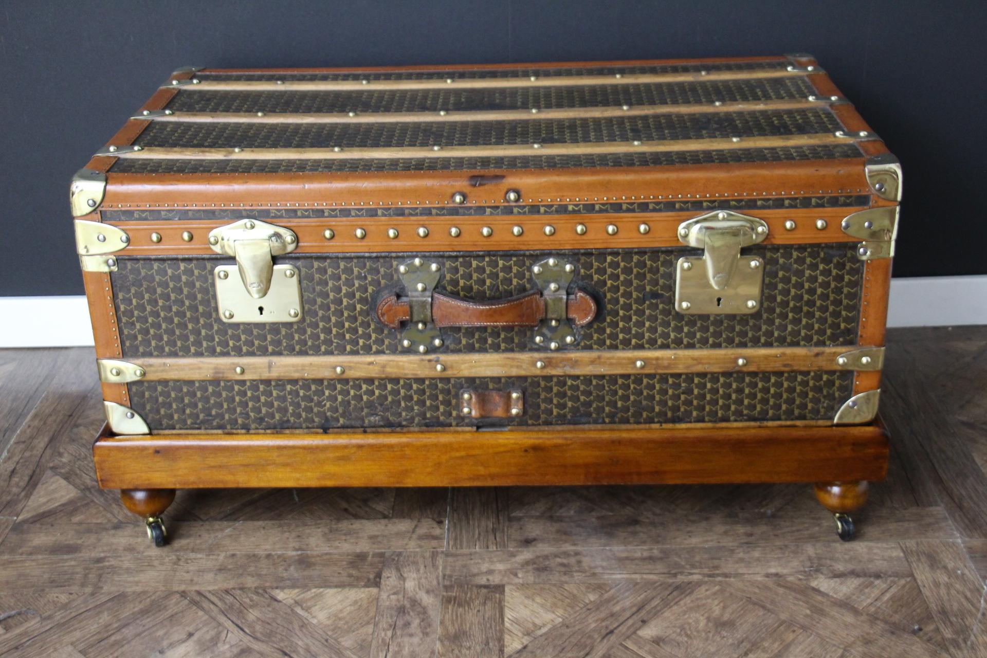 This Moynat steamer trunk features the very nice and sought after hand-painted typical 'M'-pattern canvas as well as brass corners, 2 brass Moynat stamped locks, toffee color lozine trims ,two large leather side handles and one on the front with