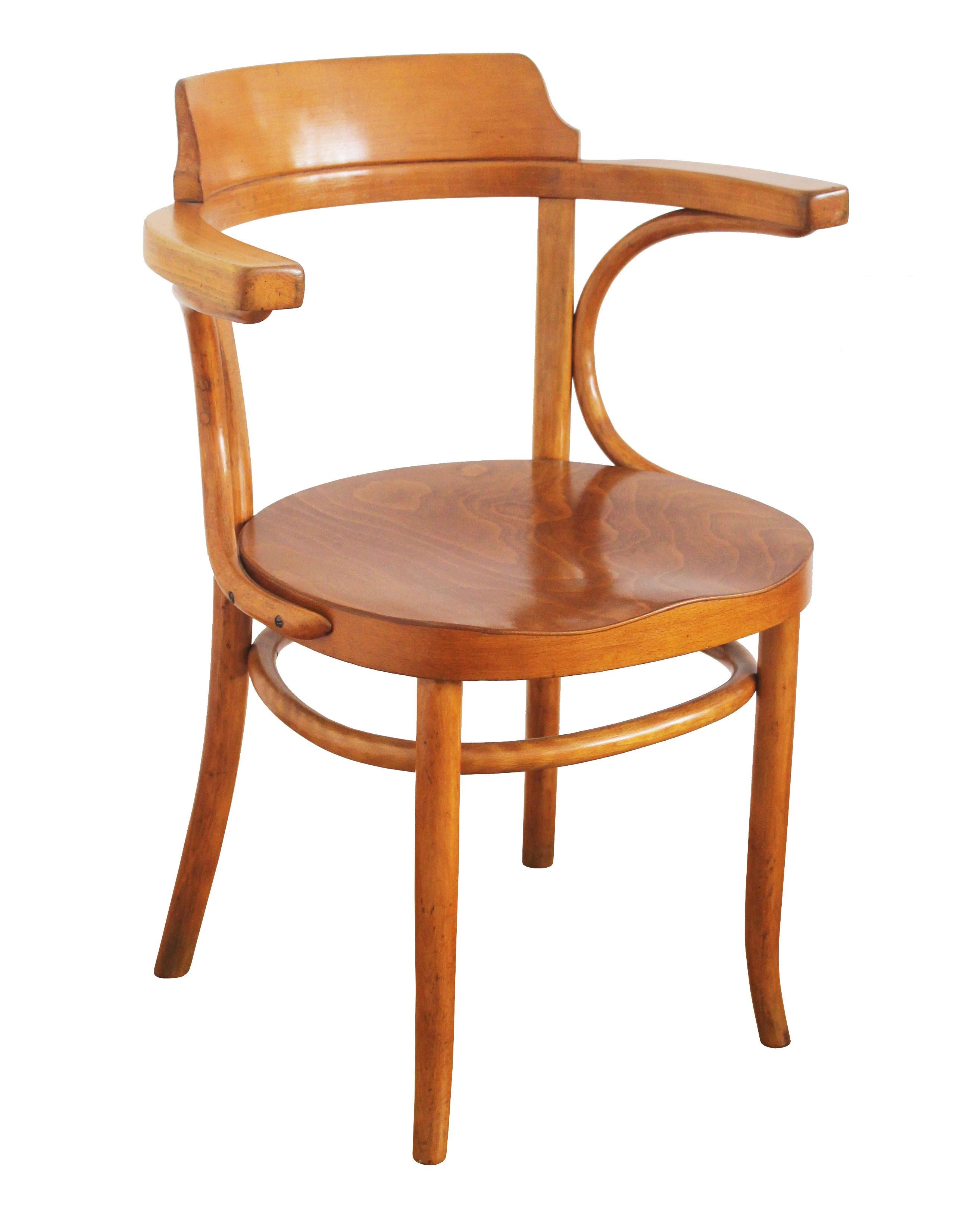 The dining chairs was originally designed by the Thonet company in 1904, and can be found in the Thonet sales catalogues as model number 3.

Despite having only Mundus label underneath the seat, this particular piece is believed to be made by the