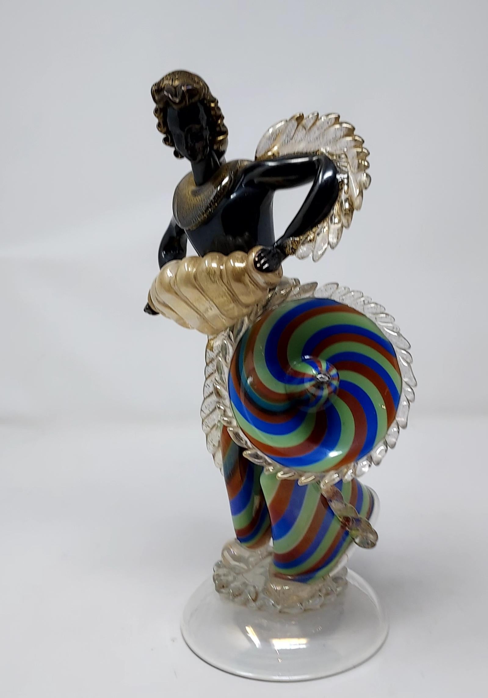 1930s hand-blown art deco figure of an accordion player. Attributed to Ercole Barovier for Barovier & Toso. The figure is in Iridescent glass.
 