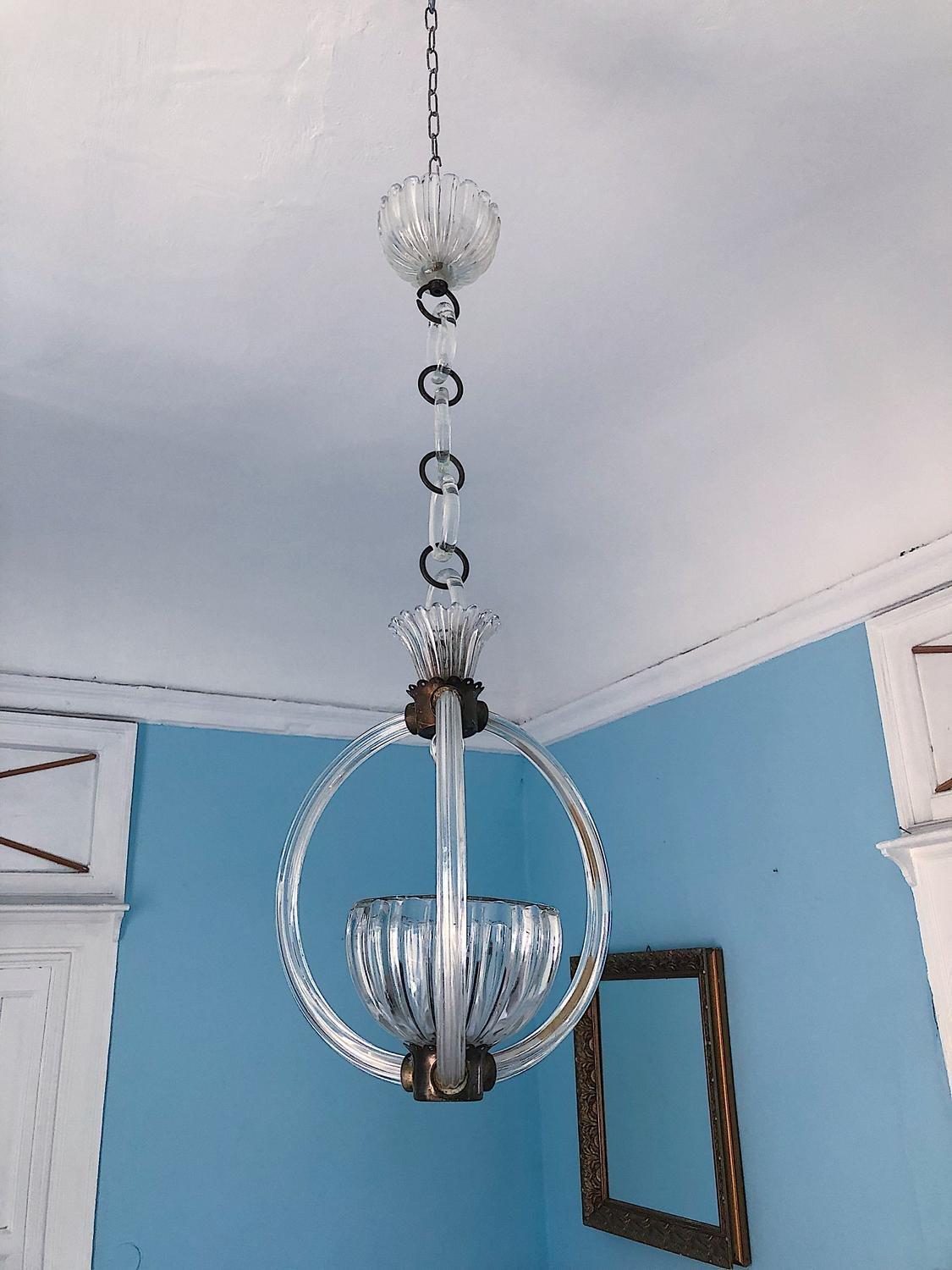 Fabulous 1930s chandelier by Barovier&Toso, Murano.
Note that the beautiful chain is also made of glass. The light has 1bulb.
Creator: Barovier & Toso, Murano
Dimensions: Height 90 cm Diameter: 35 cm
Materials and Techniques: Brass, Glass
Place of