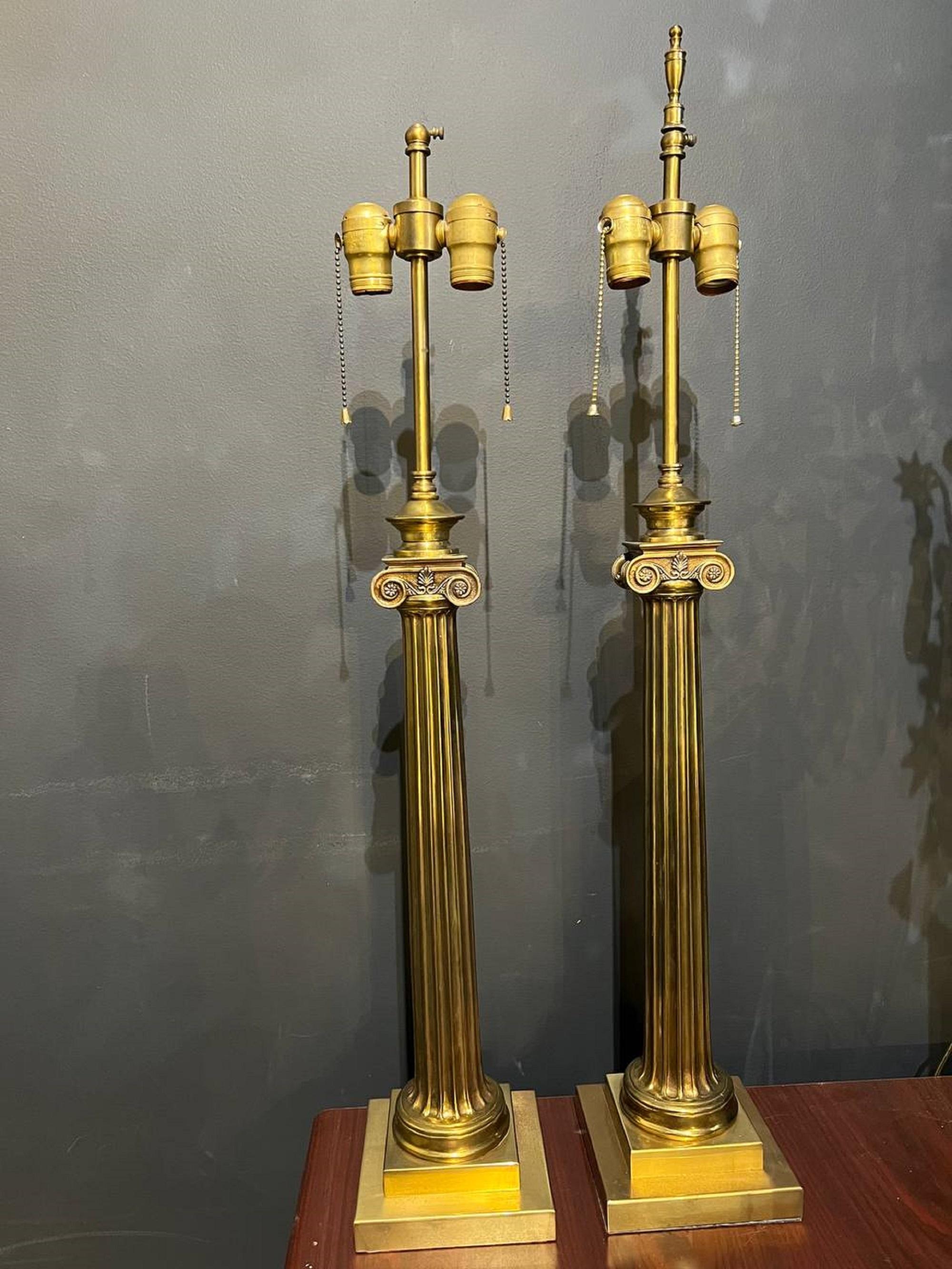 A circa 1930's neoclassic column shape bronze table lamps. In very good condition.