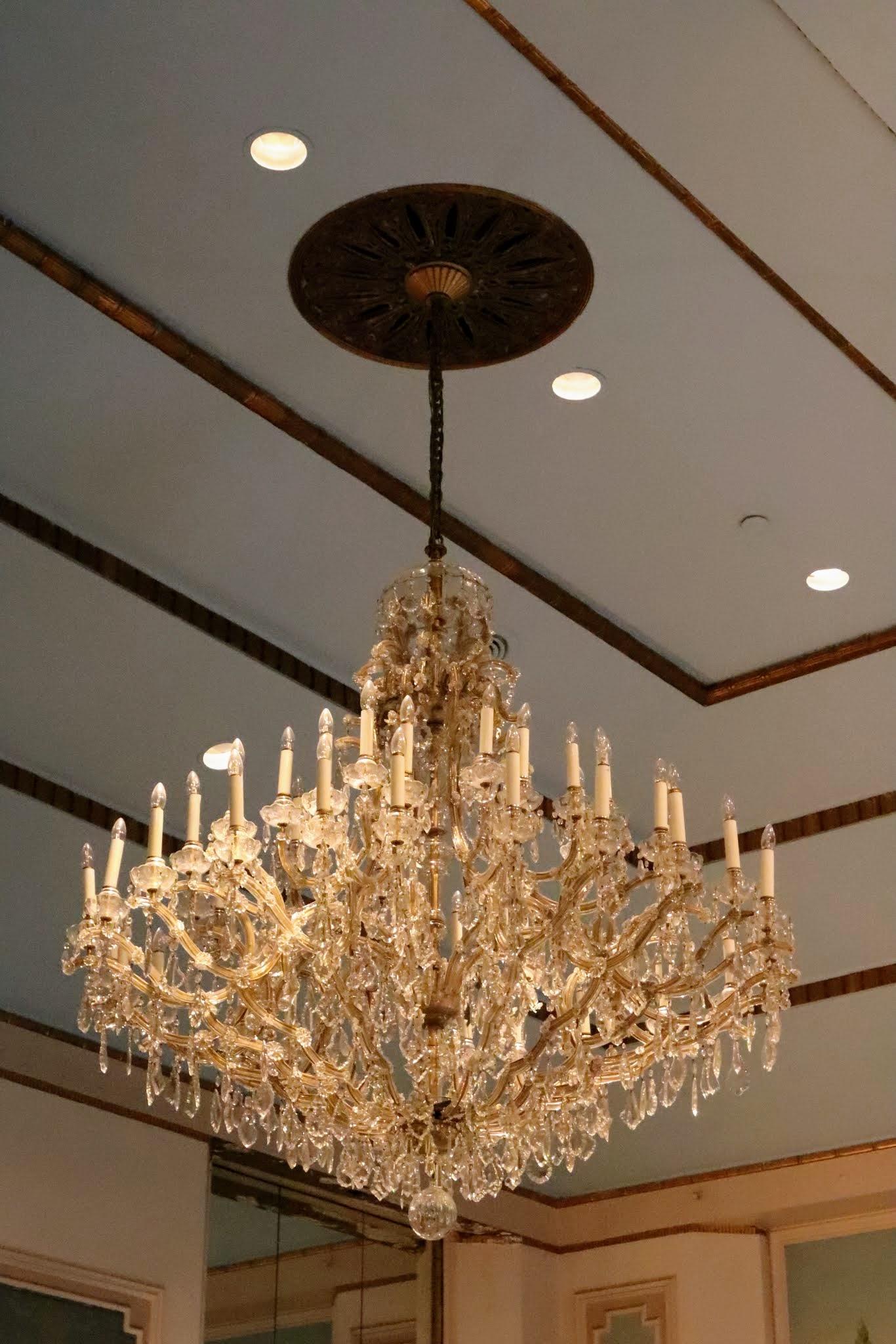 Please note, bronze ceiling medallion is not included. This was not retrieved. This grand 20th century Czechoslovakian Marie Therese clear crystal chandelier is from the 1931 NYC Waldorf Astoria Hotel, and graced the Louis XVI Conference Meeting