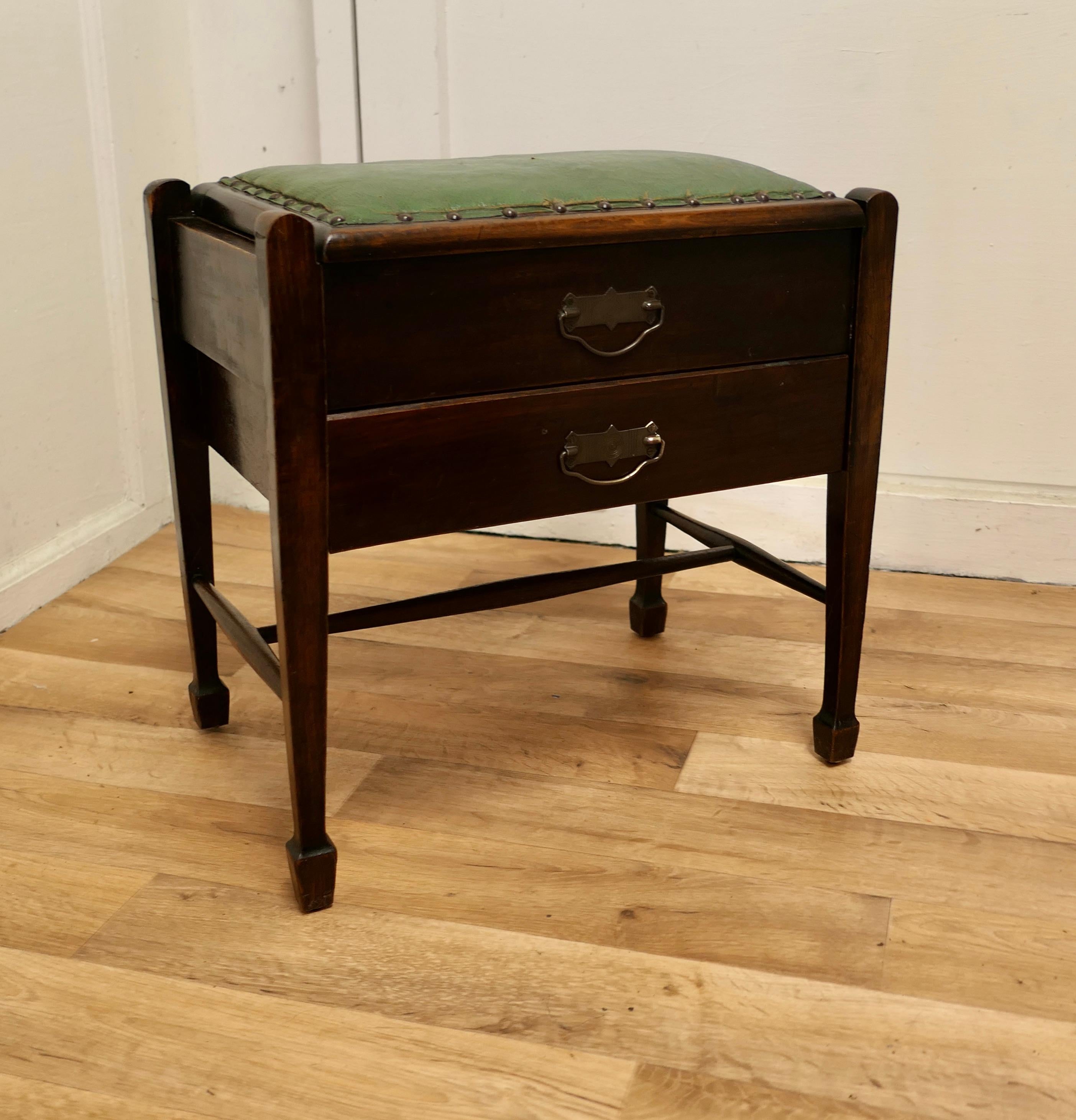 1930s Oak sewing box table with drawer.

This is a good sturdy side table, with a good colour, just open the top to find a blue satin lining in the lid and a divided storage compartment with a removable tray and a drawer underneath all in good