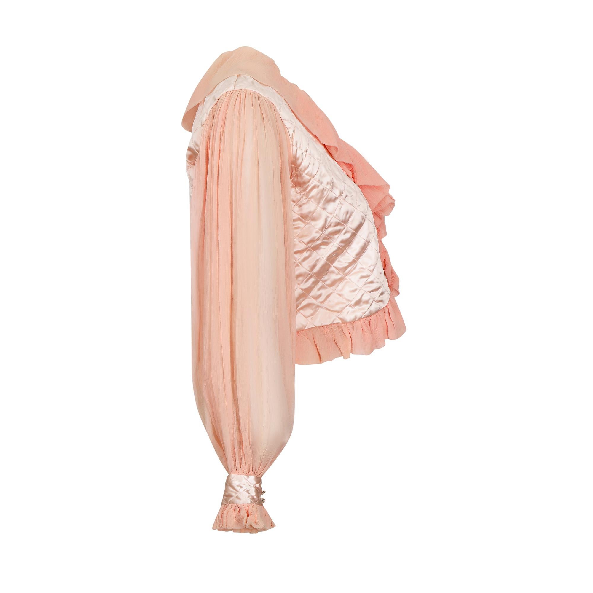 Sublime late 1930s or 1940s silk crepe and satin quilted bed jacket. The original version of loungewear but this is far too pretty to wear in bed! The jacket is a lovely peachy pink with very full voluminous long chiffon sleeves. The cuffs are satin