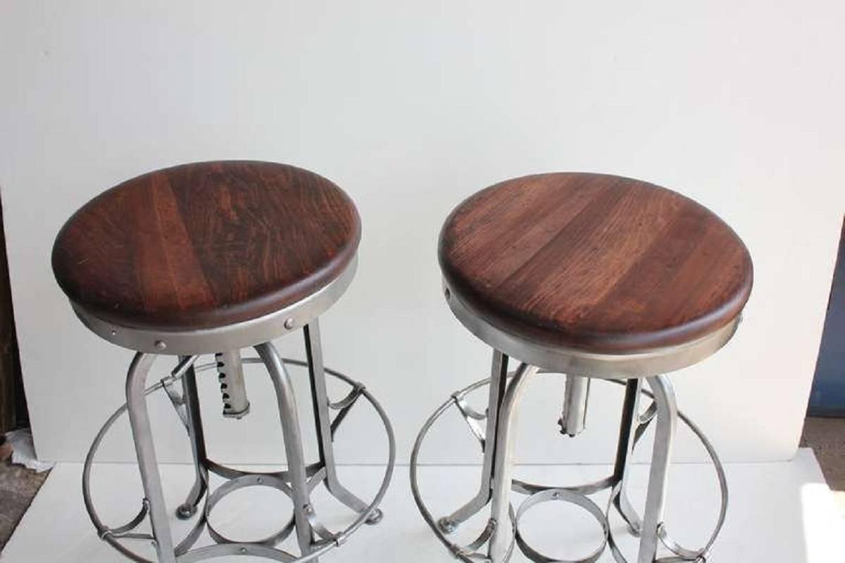1930s original American Toledo stool, more available. Listed price is for each stool. Refinished base and wooden top. Height is adjustable from 25.5