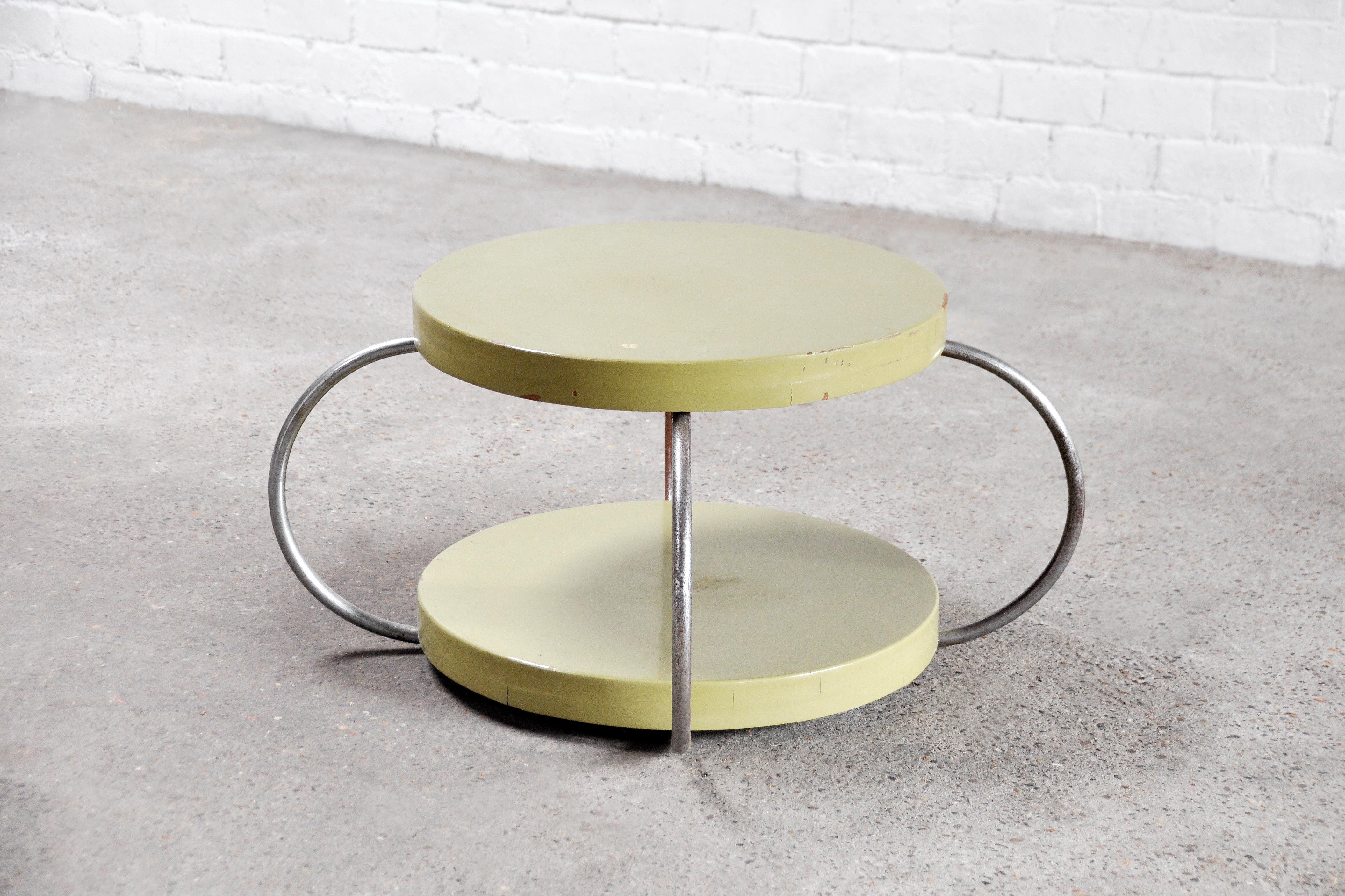 A unique and completely original early bauhaus coffee or side table. The table tops are made out of mint green lacquered wood. Two tier system connected by sculptural steel tubes. A never before seen and rare early model in completely original