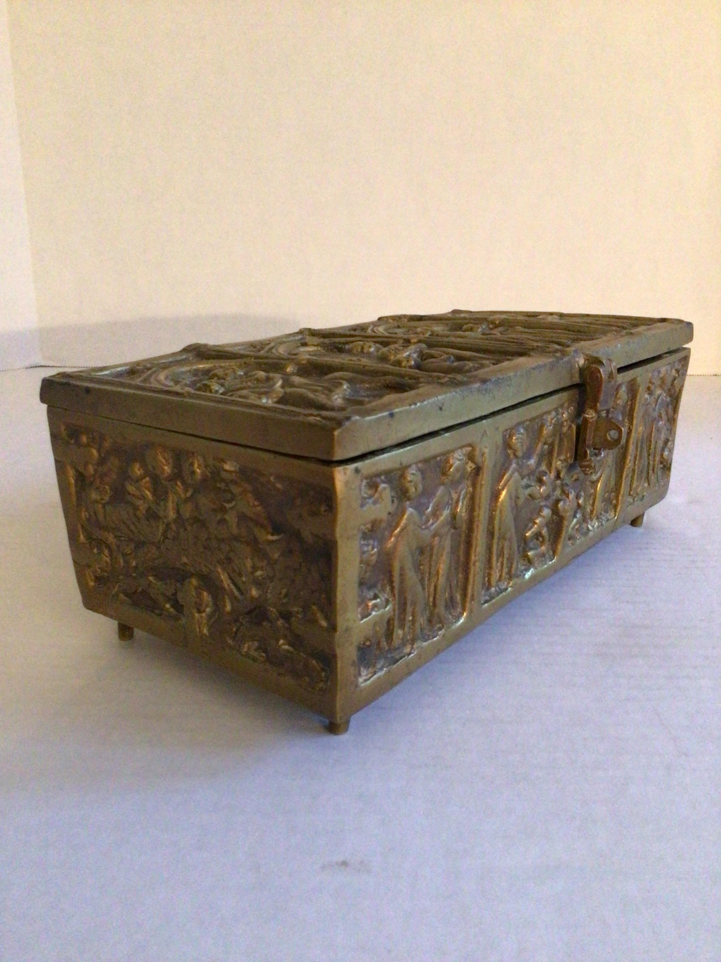 This 1930s Ornate Bronze Box/Casket features religious figures and has a hinged top with hinged latch
All sides have a patina which adds depth and beauty
Underside is marked 
