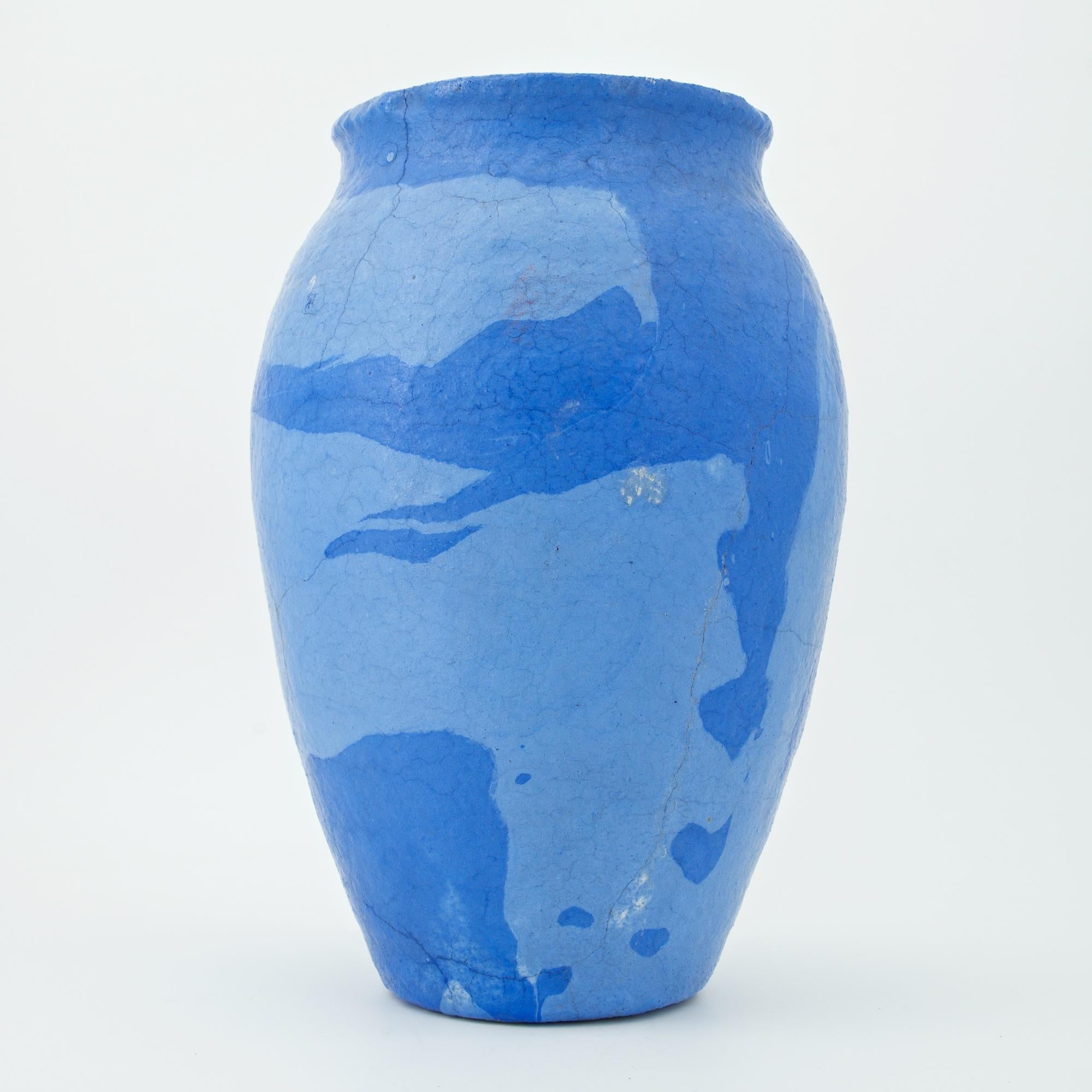 Ozark Pottery Company vase in blue and light blue swirled glaze. When demand for utilitarian ware waned, many potteries introduced their art line. Artificially coloring the clay and turning it on the potter's wheel made pieces with a marbleized or