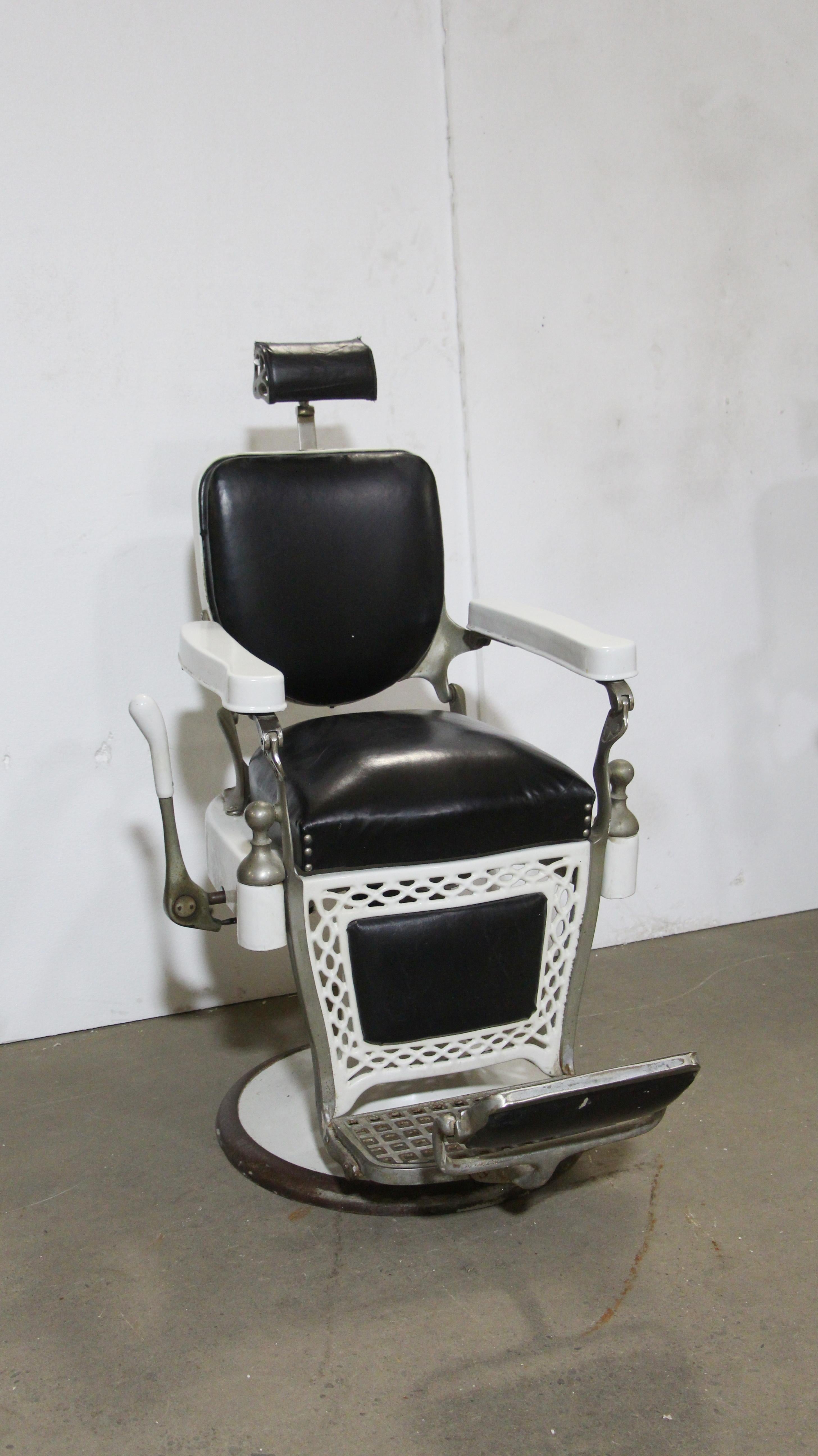 Original 1930s Paider barber chair done in white porcelain and black leather upholstery. This can be seen at our 400 Gilligan St location in Scranton, PA.