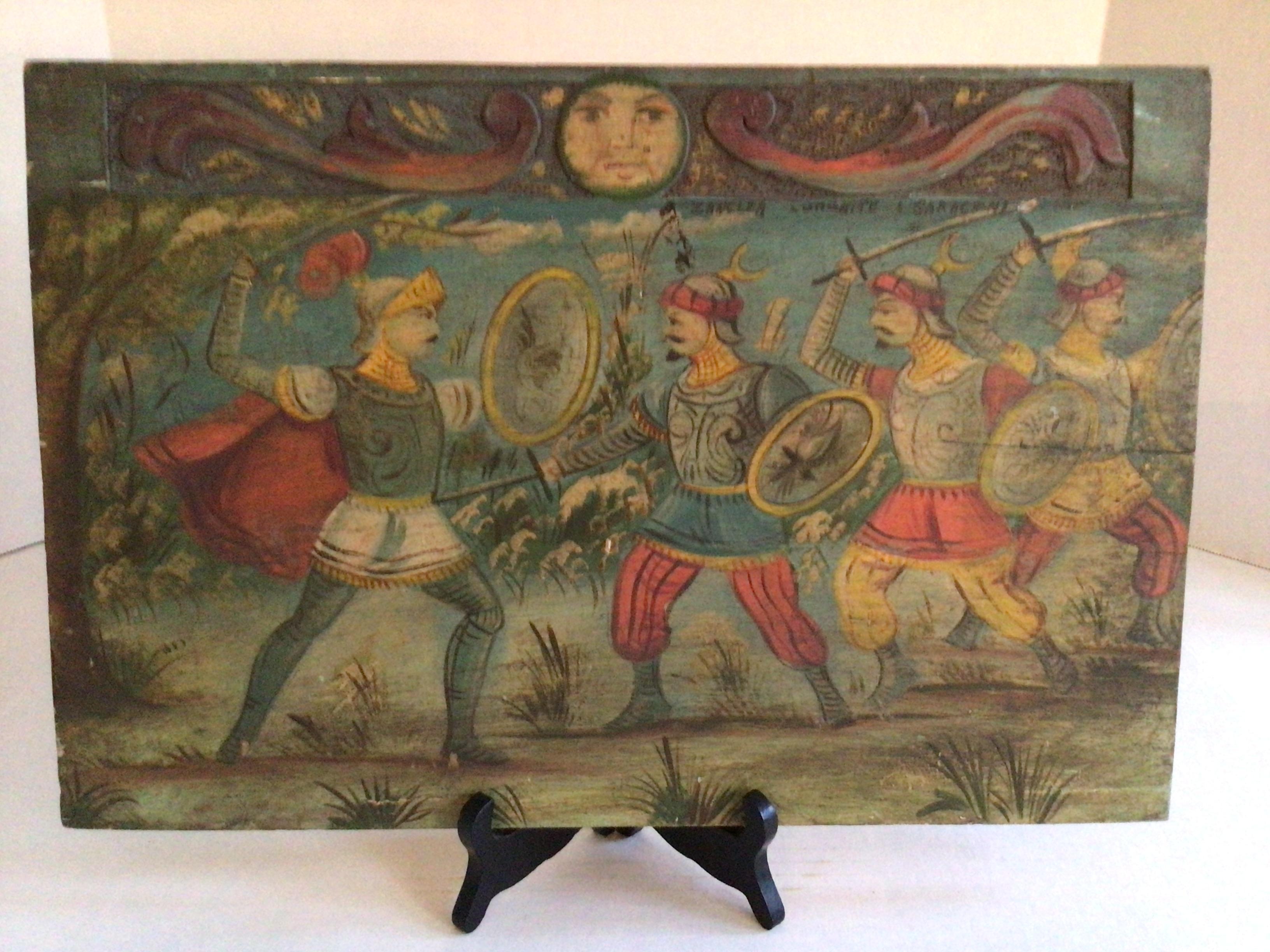 1930s Painting on Wood Board of Knights in Sword Battle 
Carving on top with stippled holes in the wood
Wood display stand not included
