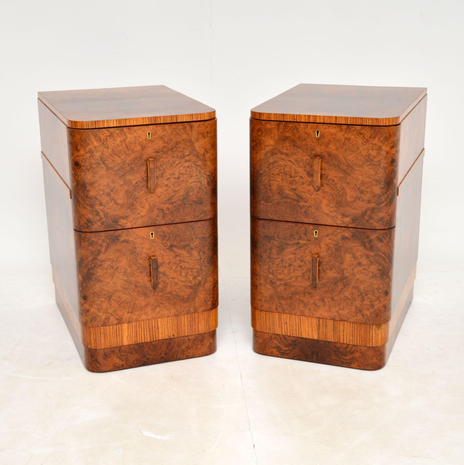 A beautiful pair of original Art Deco period bedside chests in Walnut. These were made in England, they date from the 1930’s.

They are of amazing quality, have a beautiful design and are a very useful size with lots of storage space. The drawer