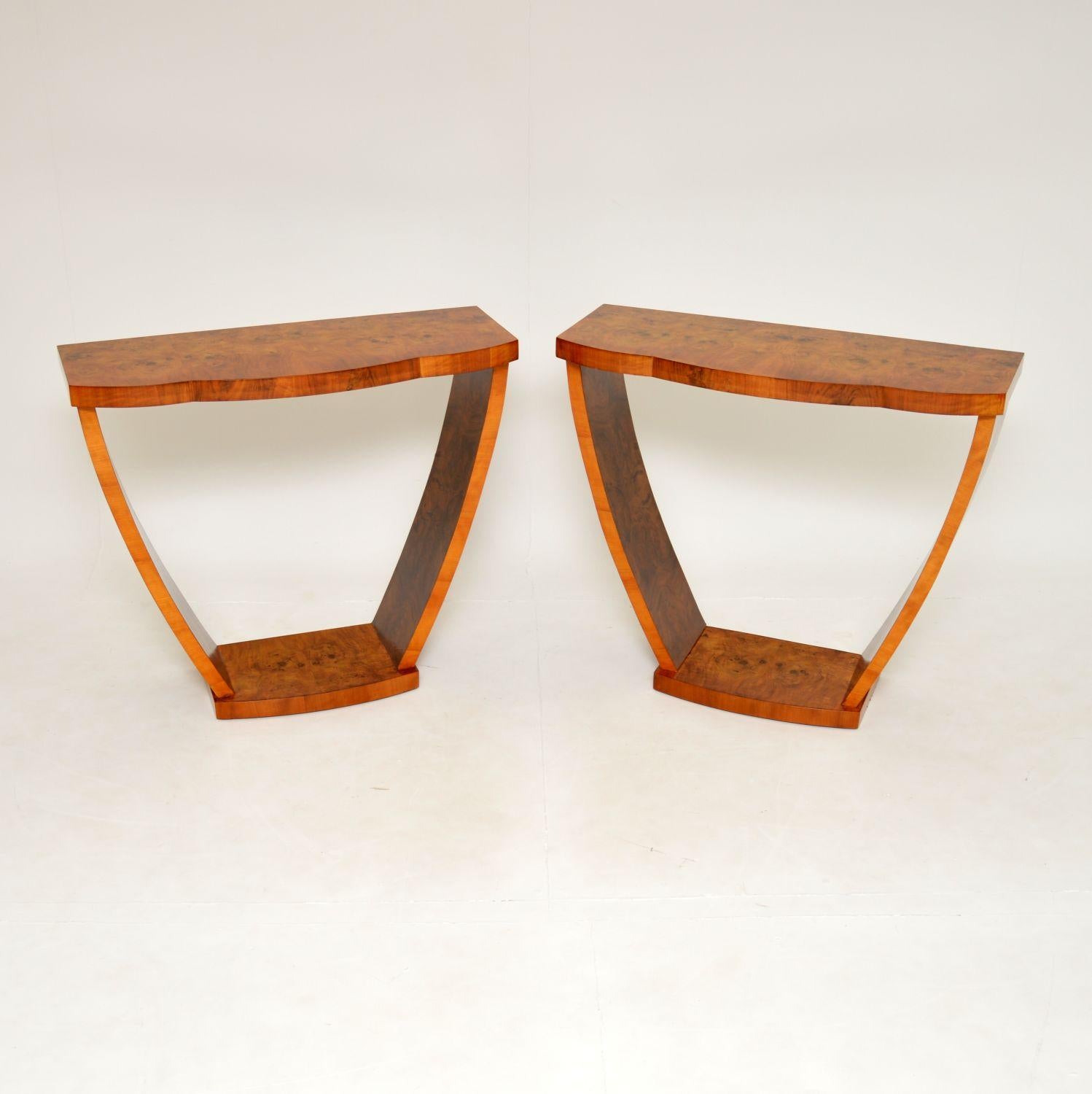 A magnificent and very rare pair of original Art Deco period console tables in burr walnut. These were made in England, they date from around the 1930’s.

The quality is amazing and these are a lovely, useful size. They have an elegant design, not